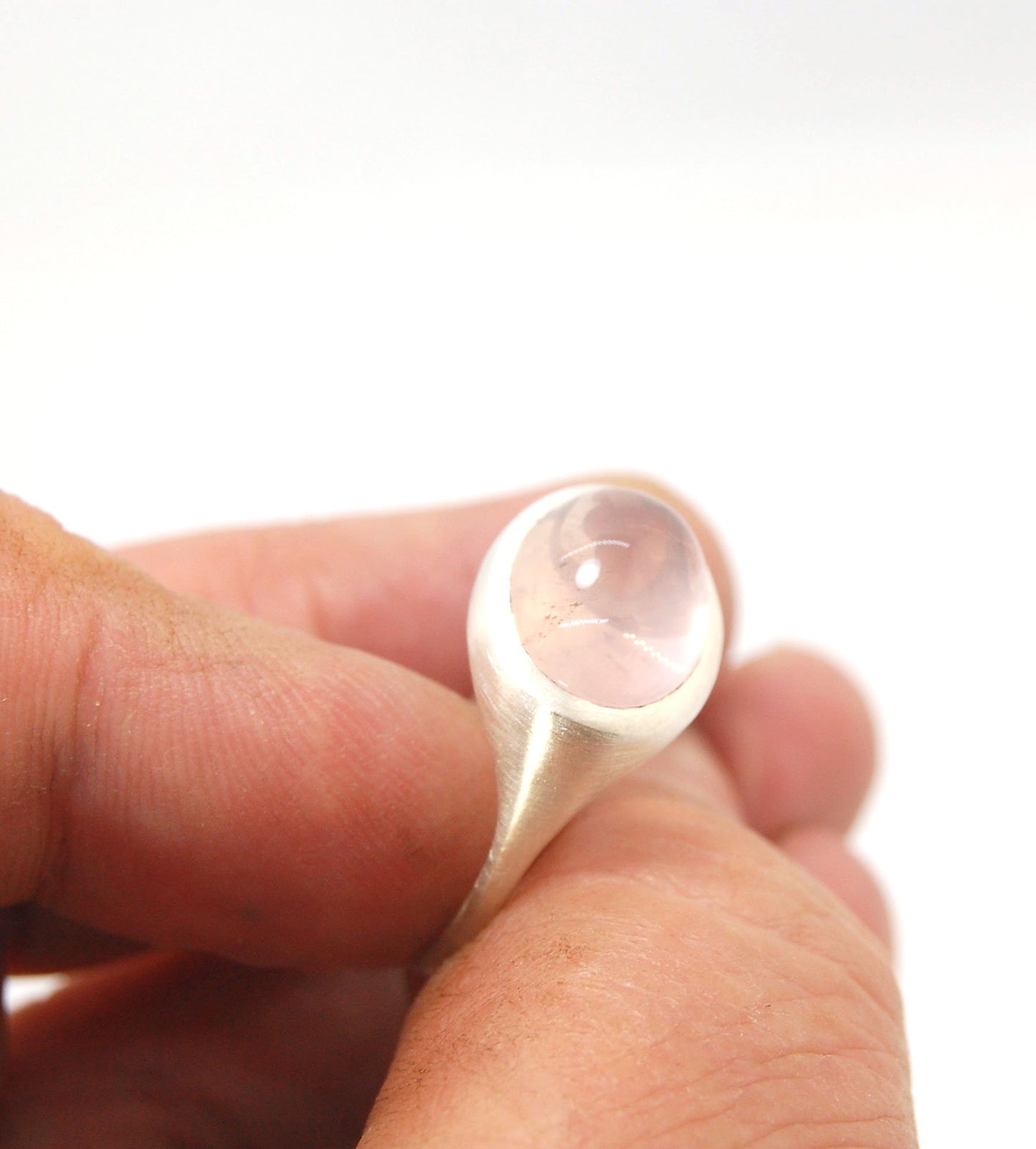 Rose Quartz Ring in Brushed Silver This is one of my first wax carved designs cast in sterling silver using a lost wax process. I start with a piece of wax and math and start carving until the ring is revealed! The back of the rIng is fully open so the ro