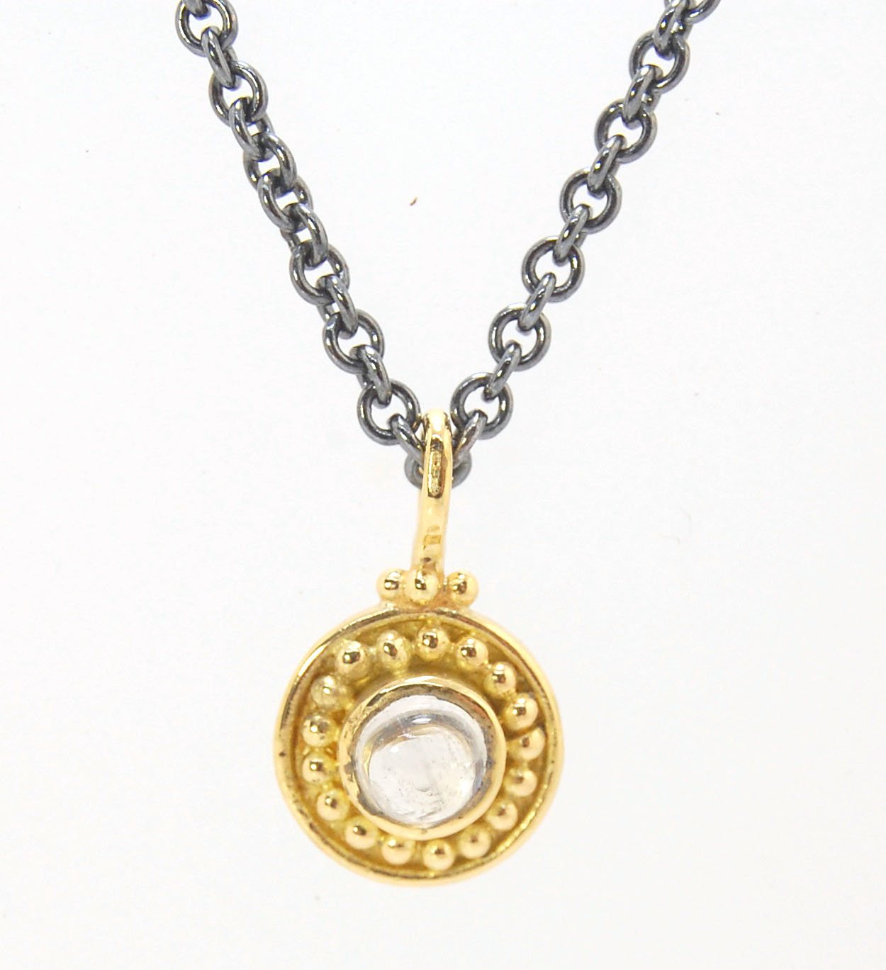 Tiny Round Rainbow Moonstone 18k gold Granulated Pendant This beautiful tiny round rainbow moonstone has so much luminance! A bezel-set small round rainbow moonstone is surrounded by larger 18k gold granules and can be ordered on the your chain of choice.