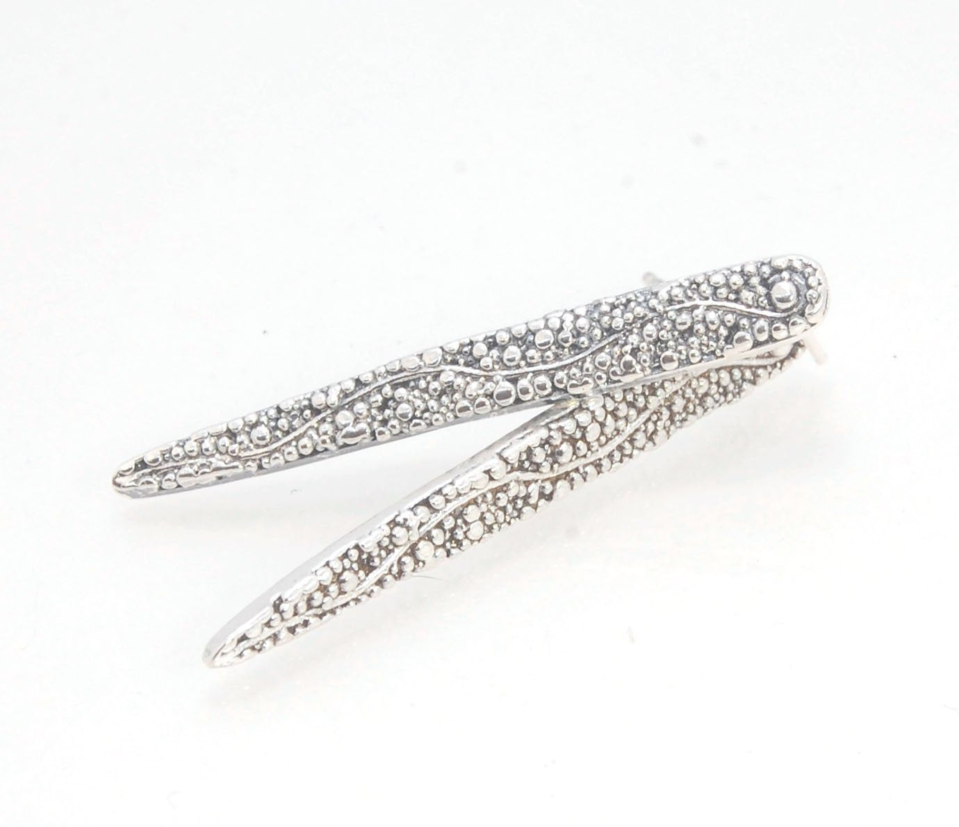 Seaweed Pattern Long Dagger Posts These seaweed dagger post earrings are long, elegant points of silver filled with a granulation pattern I call Seaweed, as it looks like it has so much movement in the varying-sized granules. These are cast versions of my