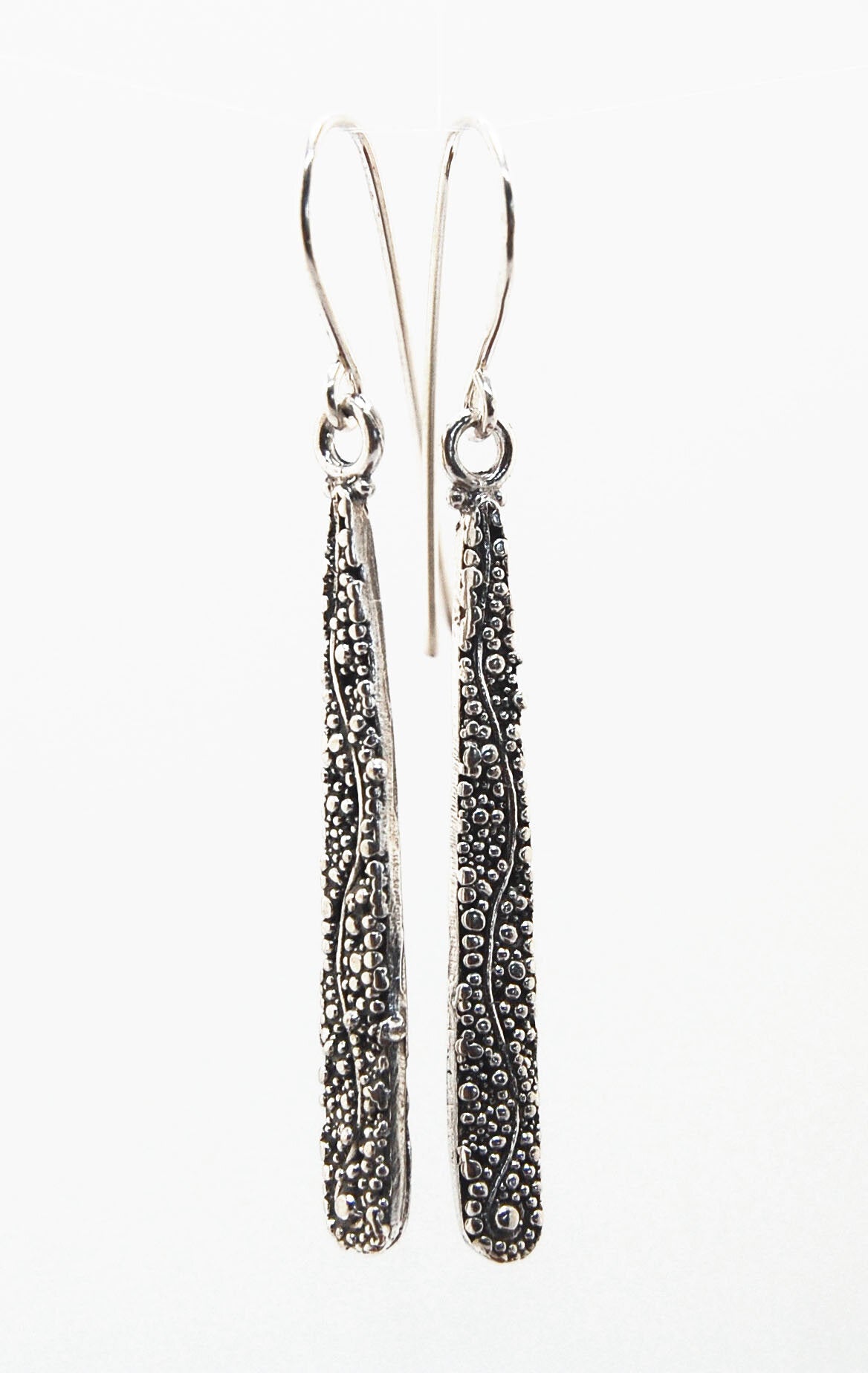 Seaweed Dangles - Long Earrings These seaweed dangle have terrific movement and sparkle. These are cast versions of my original granulation work, which is then molded for repeat waxes and cast using the ancient Lost Wax Process. Granulation is an ancient