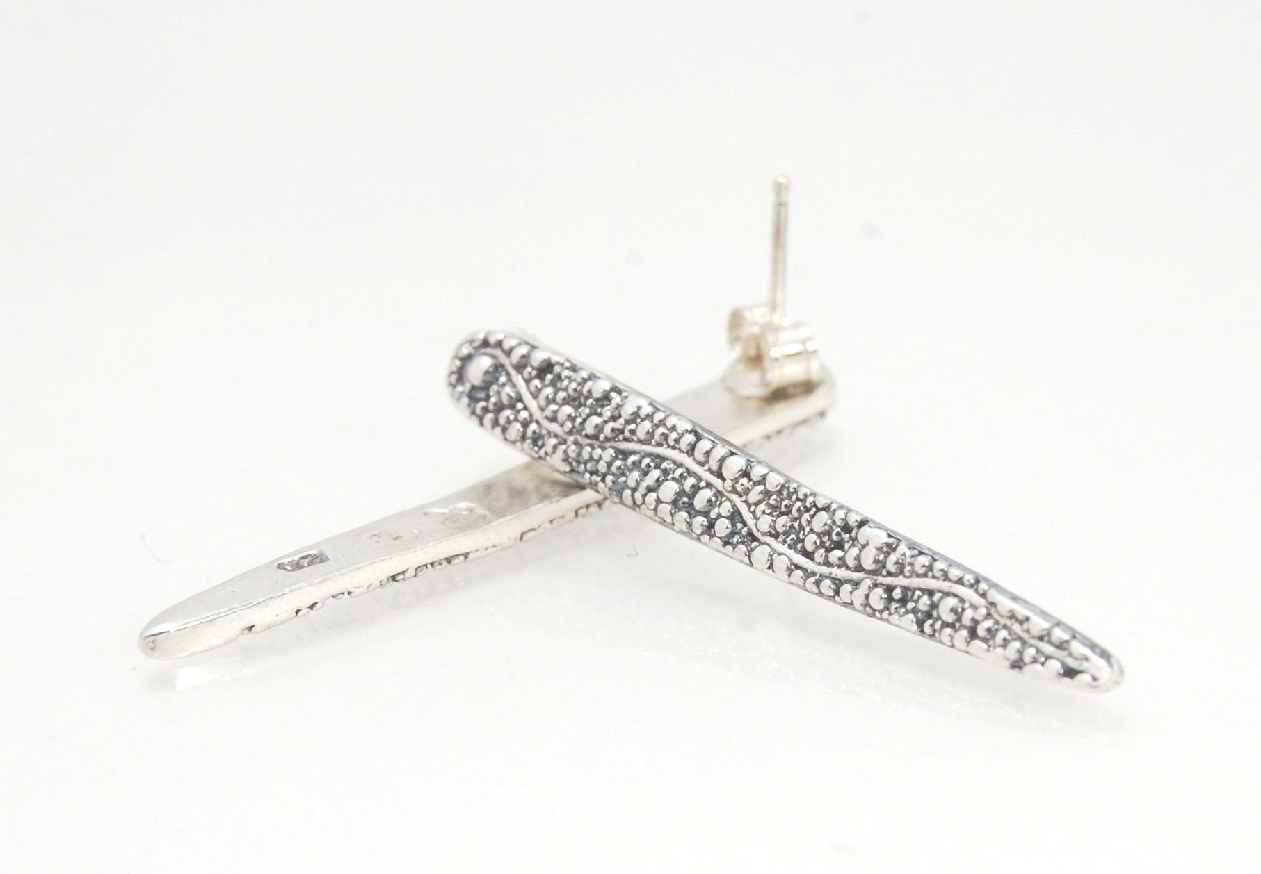 Seaweed Pattern Long Dagger Posts These seaweed dagger post earrings are long, elegant points of silver filled with a granulation pattern I call Seaweed, as it looks like it has so much movement in the varying-sized granules. These are cast versions of my