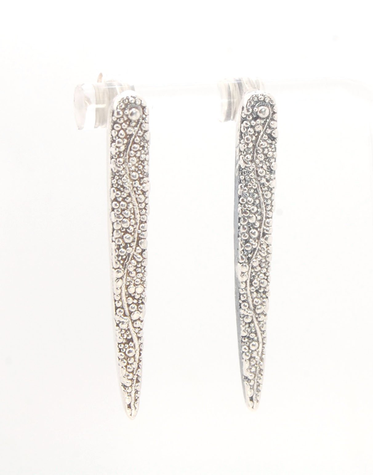 Seaweed Pattern Long Dagger Posts These seaweed dagger post earrings are long, elegant points of silver filled with a granulation pattern I call Seaweed, as it looks like it has so much movement in the varying-sized granules. These are cast versions of my