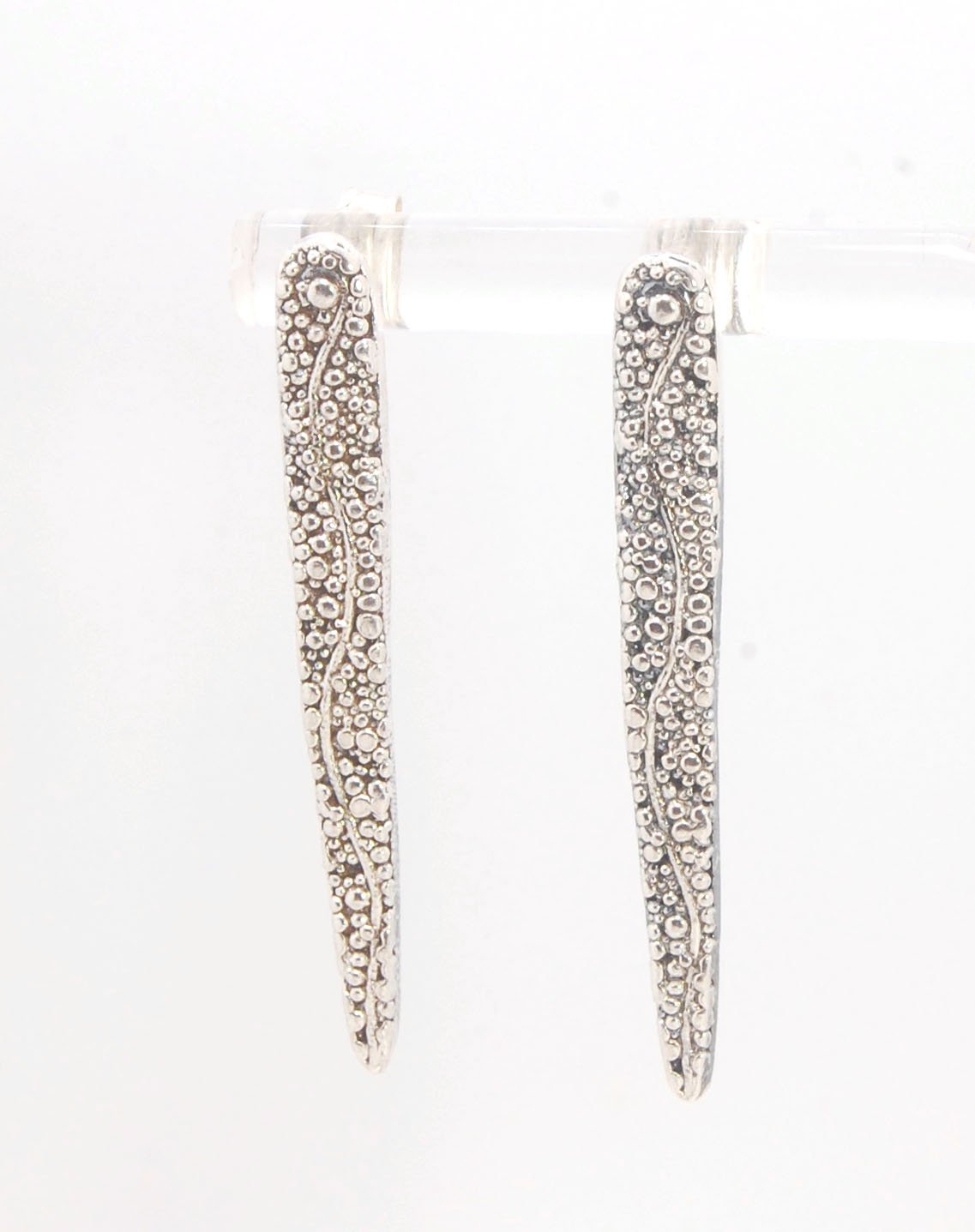 Seaweed Pattern Long Dagger Posts These seaweed dagger post earrings are long, elegant points of silver filled with a granulation pattern I call Seaweed, as it looks like it has so much movement in the varying-sized granules. These are cast versions of my