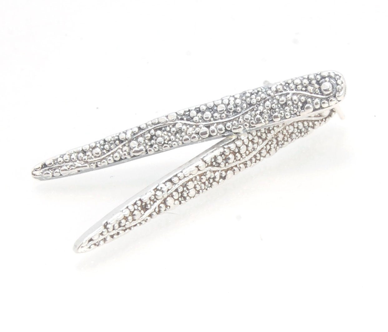 Seaweed Pattern Long Dagger Posts These seaweed dagger post earrings are long, elegant points of silver filled with a granulation pattern I call Seaweed, as it looks like it has so much movement in the varying-sized granules. These are cast versions of my