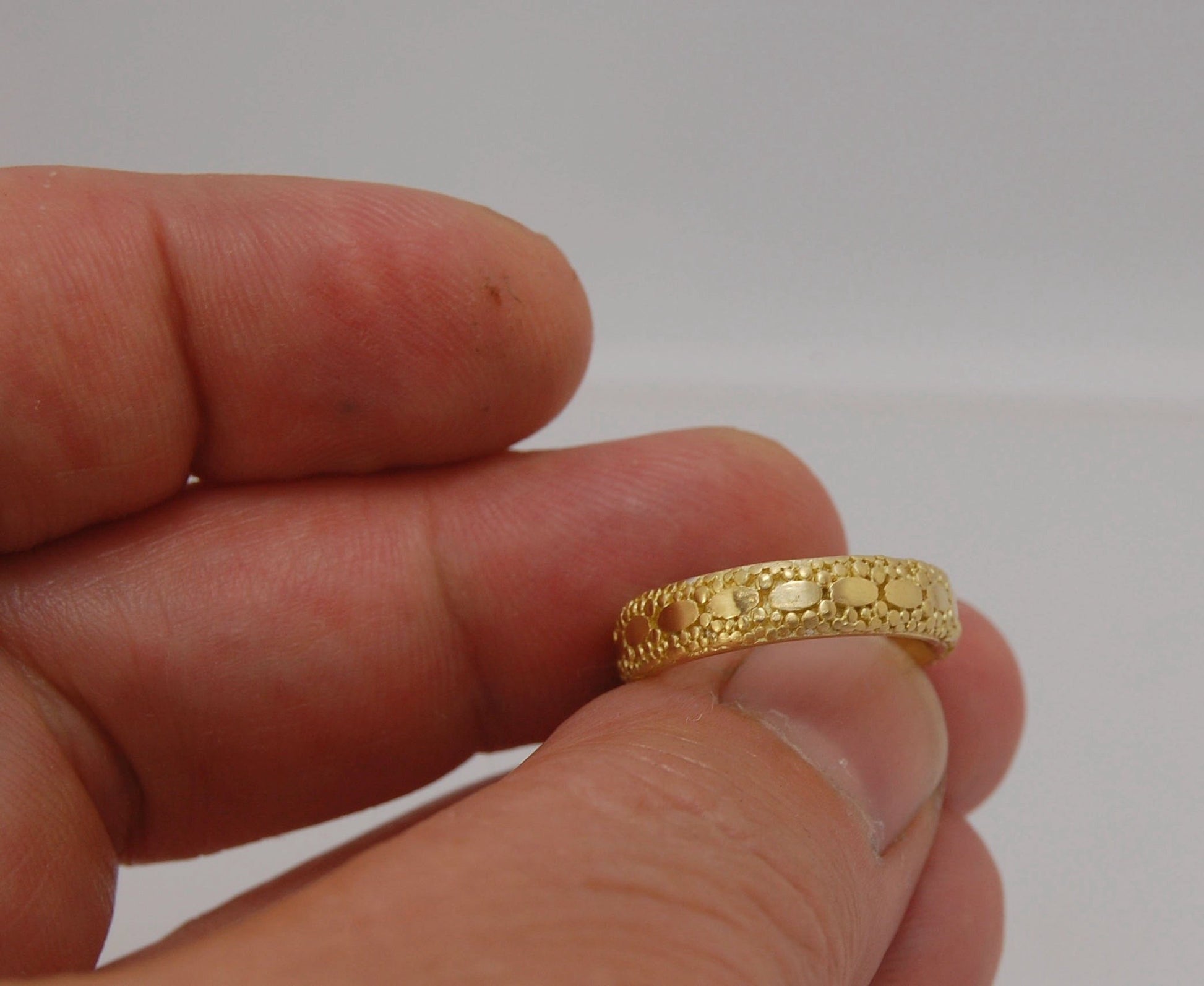 Oval Lace Granulation Ring in 18k Gold This is a stunning band I made from 18k Gold using the process of Granulation. I am happy to make one for you in your size. Each is one of a kind and handmade for you.Granulation is an ancient fusing process utilized