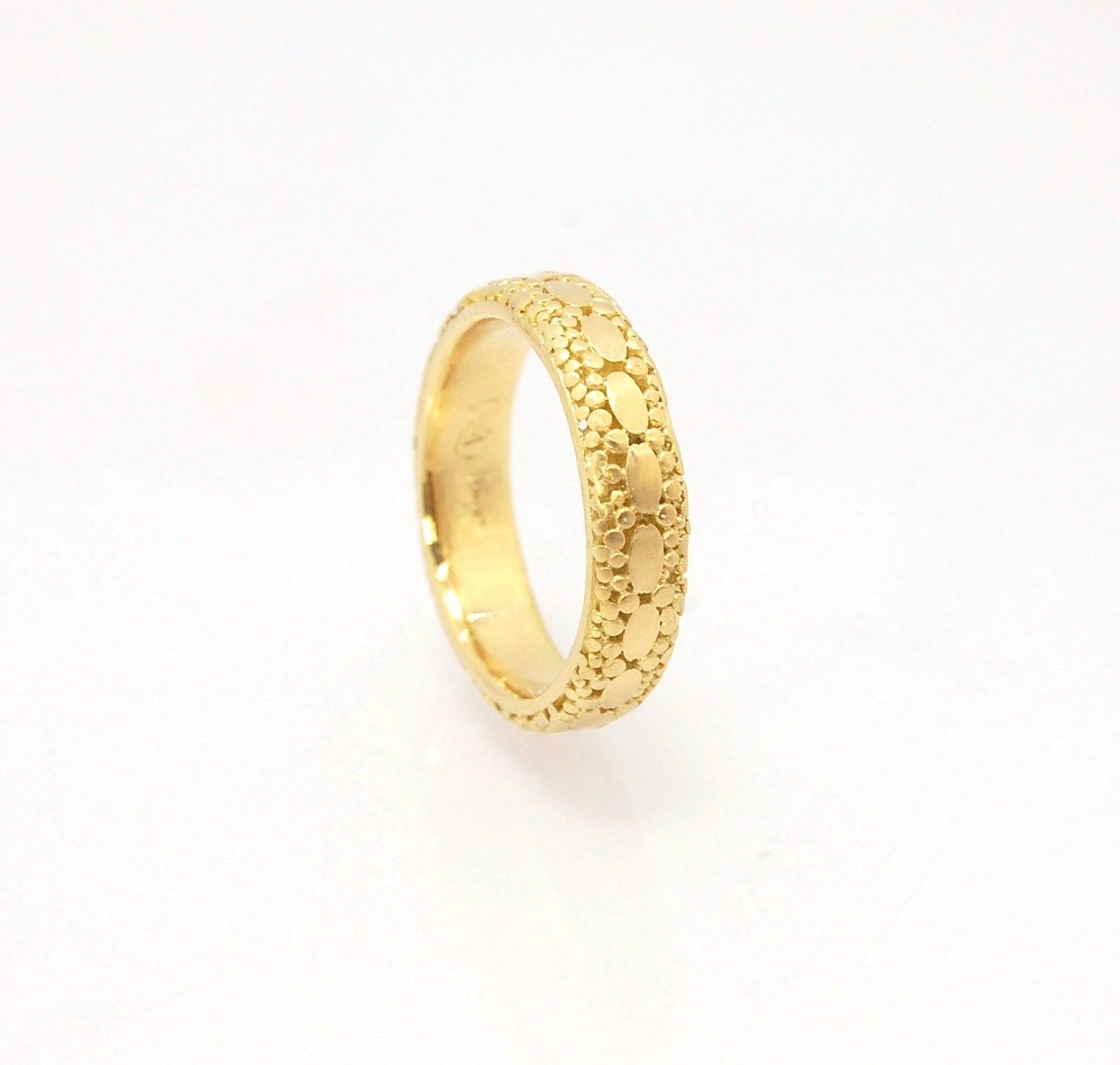 Oval Lace Granulation Ring in 18k Gold This is a stunning band I made from 18k Gold using the process of Granulation. I am happy to make one for you in your size. Each is one of a kind and handmade for you.Granulation is an ancient fusing process utilized