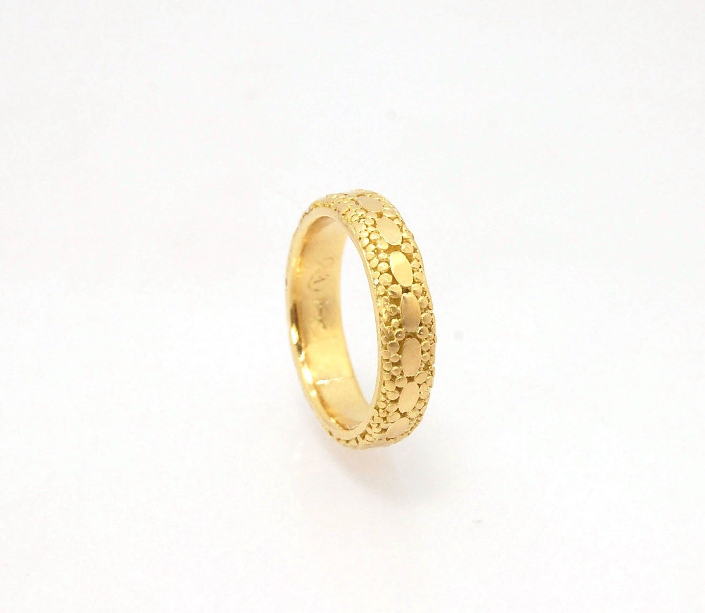 Oval Lace Granulation Ring in 18k Gold This is a stunning band I made from 18k Gold using the process of Granulation. I am happy to make one for you in your size. Each is one of a kind and handmade for you.Granulation is an ancient fusing process utilized