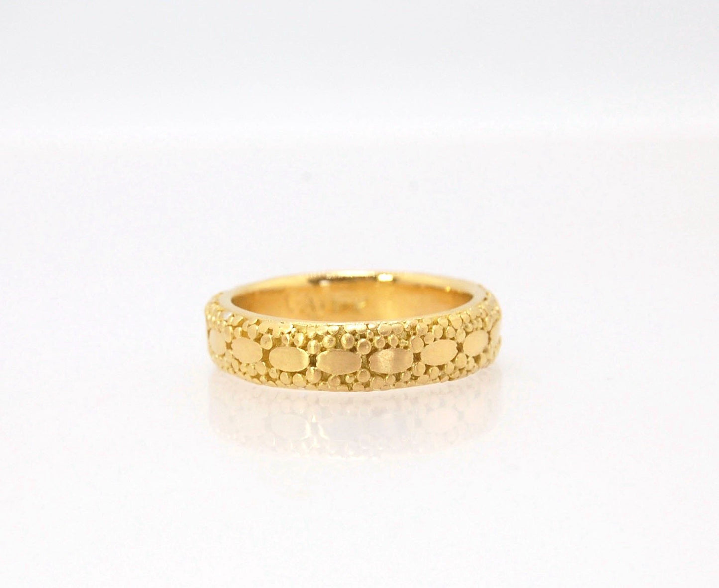 Oval Lace Granulation Ring in 18k Gold This is a stunning band I made from 18k Gold using the process of Granulation. I am happy to make one for you in your size. Each is one of a kind and handmade for you.Granulation is an ancient fusing process utilized