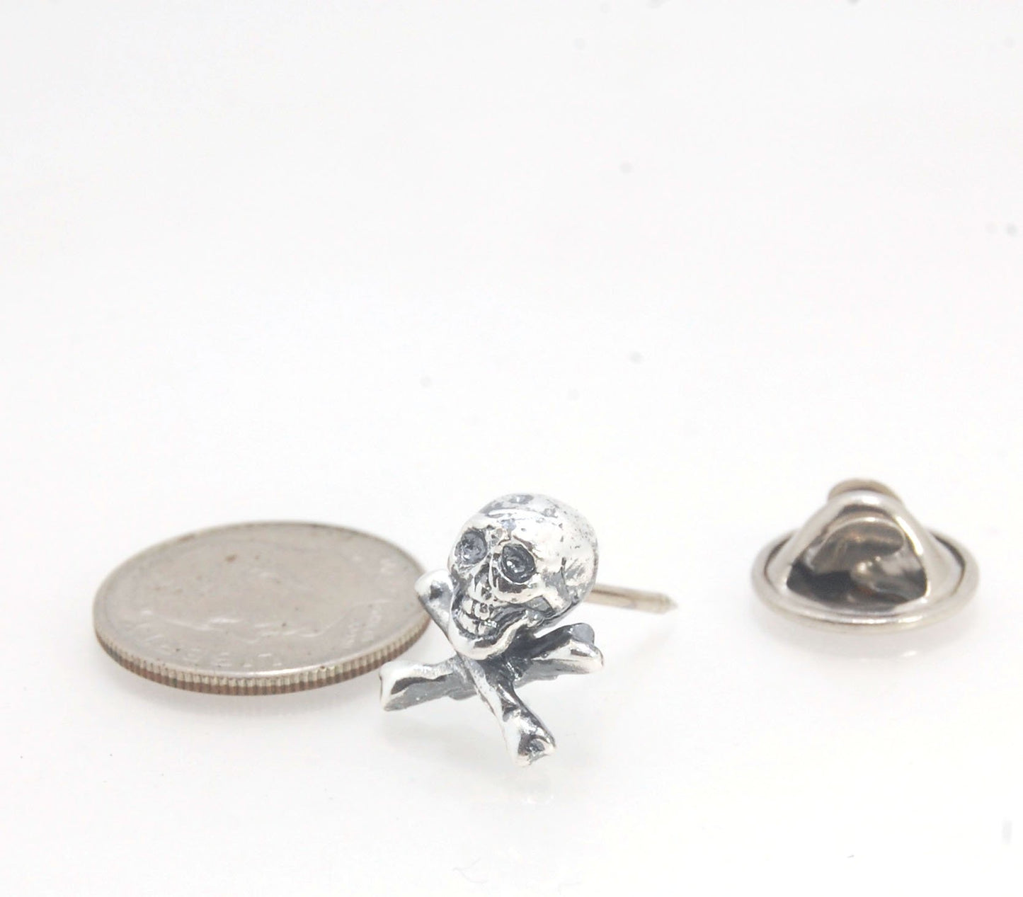 Skull & Bones Tie Tack Lapel Pin This solid sterling silver Skull & Bones tie tack label pin is wax carved by hand and cast using the ancient process of Lost Wax in sterling silver. I then made a mold, which I can inject with wax and make wax copies of th