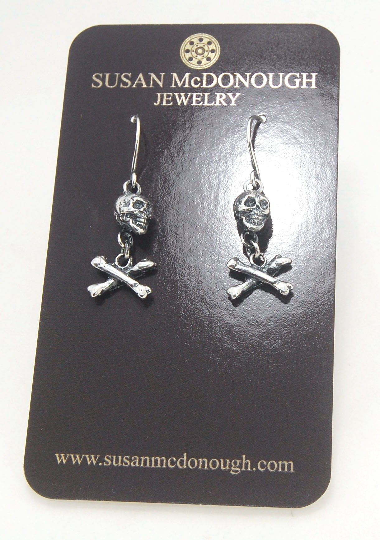 Skull & Bones Dangle Earrings These solid sterling silver Skull & Bones dangle earrings are wax carved by hand and cast using the ancient process of Lost Wax to cast them in sterling silver. I then made a mold, which I can inject with wax and make wax cop