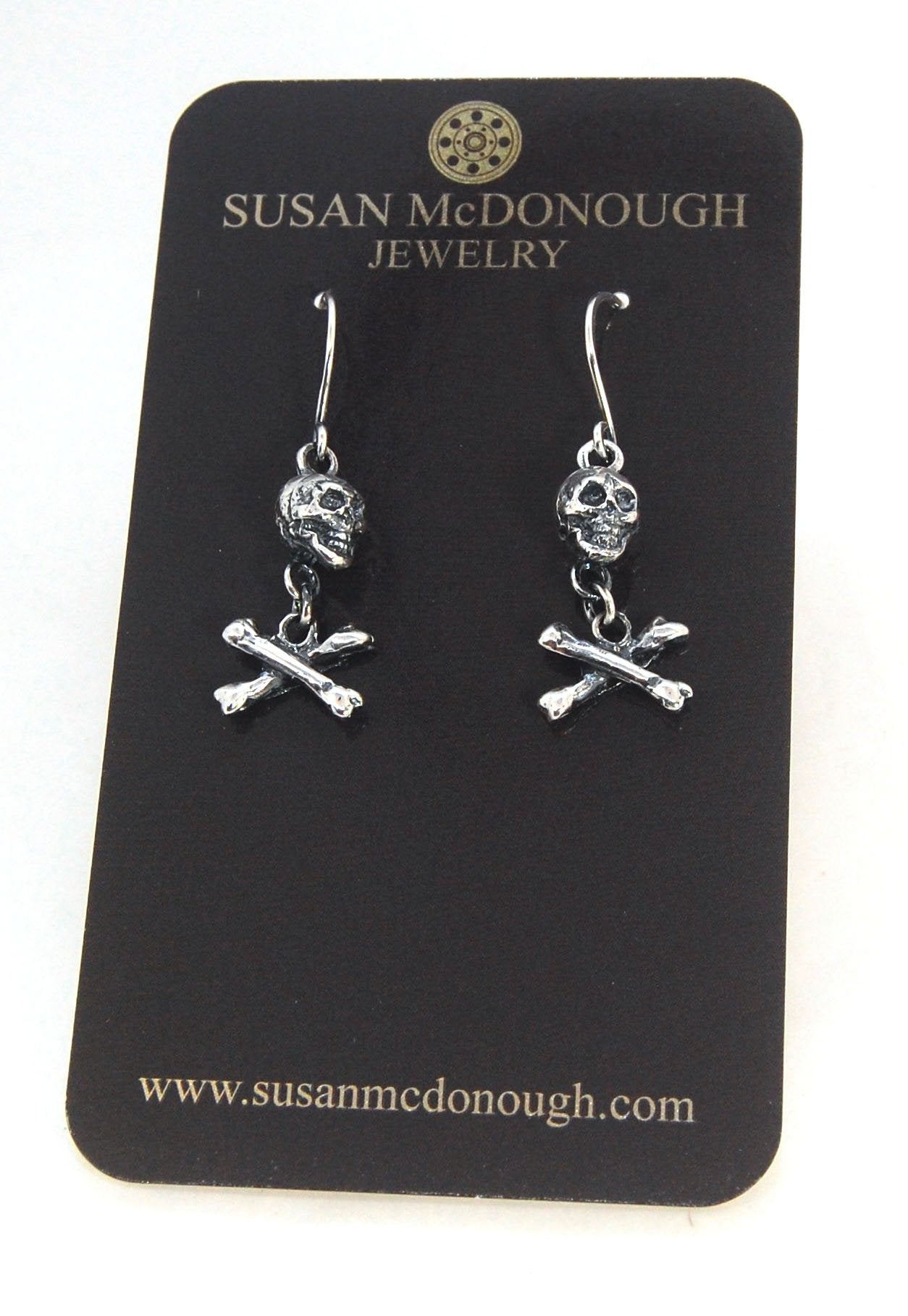 Skull & Bones Dangle Earrings These solid sterling silver Skull & Bones dangle earrings are wax carved by hand and cast using the ancient process of Lost Wax to cast them in sterling silver. I then made a mold, which I can inject with wax and make wax cop