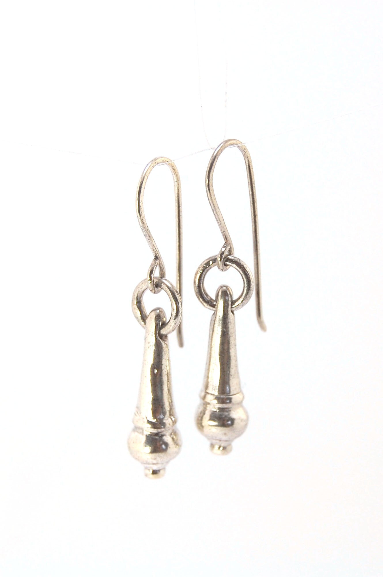 MET Drop Dangles in Sterling A play on an ancient Roman pair of Earrings I saw at the MET, these cast sterling dangle earrings have a great weight and terrific movement! I carved tthe original dangle from wax and then cast it using the Lost Wax process. T