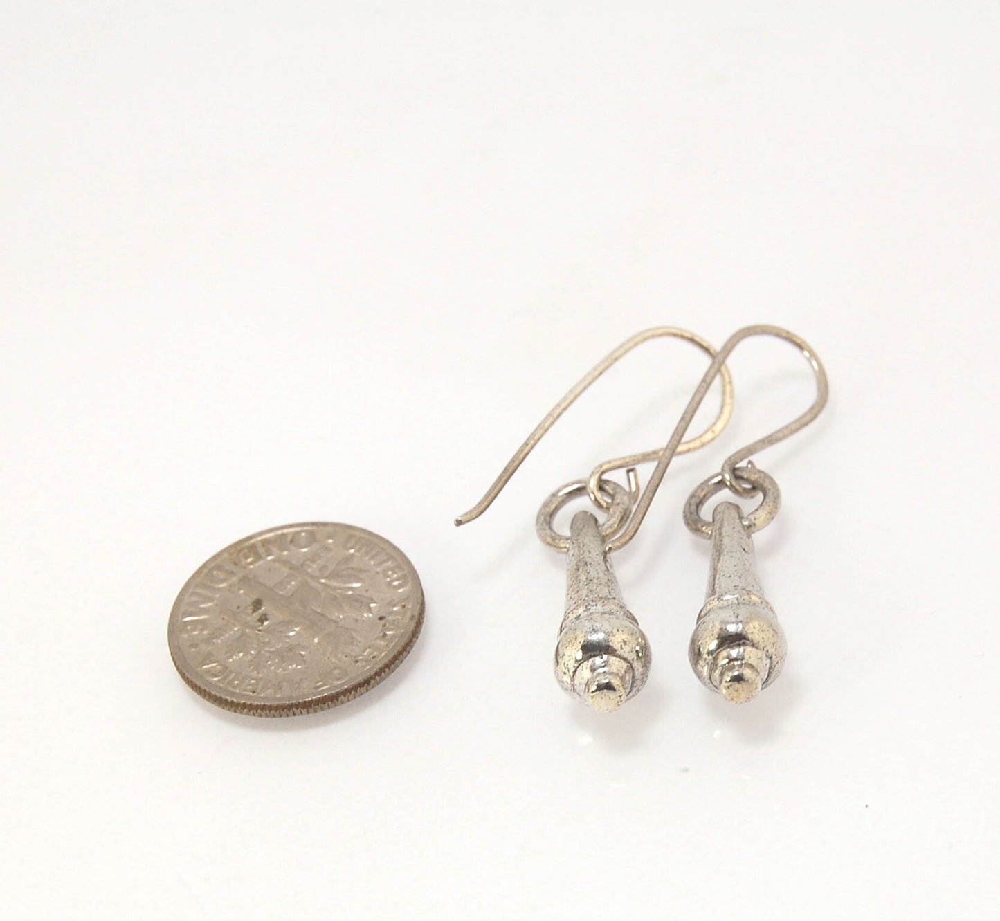 MET Drop Dangles in Sterling A play on an ancient Roman pair of Earrings I saw at the MET, these cast sterling dangle earrings have a great weight and terrific movement! I carved tthe original dangle from wax and then cast it using the Lost Wax process. T