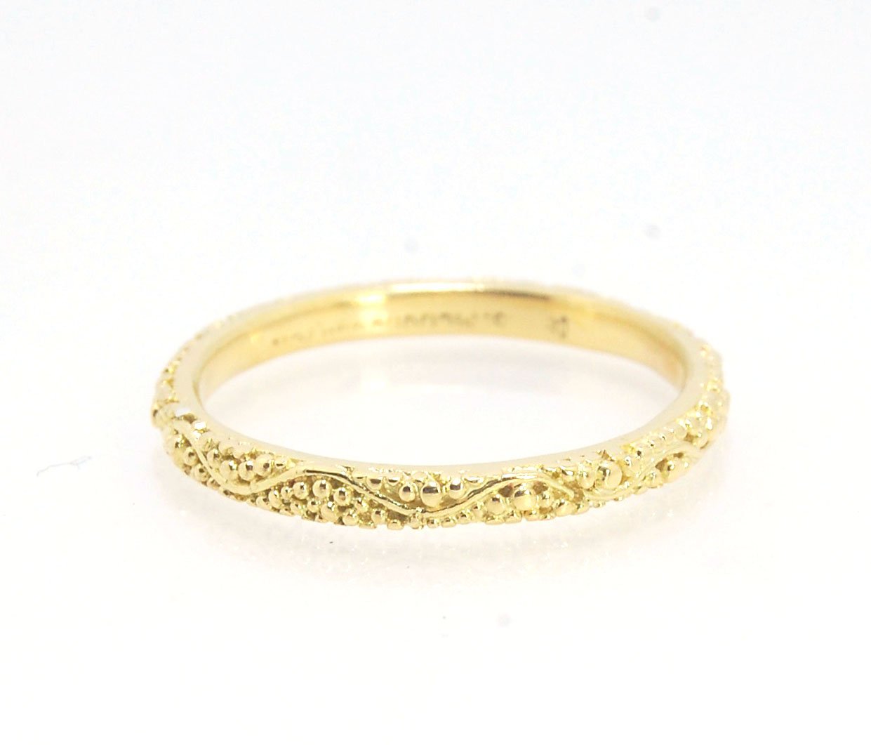 Twining Band in 18k Granulation This is a one-of-a-kind 18k ring handmade using the ancient process of granulation. The twining band is 2mm wide and has a continuous pattern around made with an ancient and unique process of granulation in 18k gold alloyed