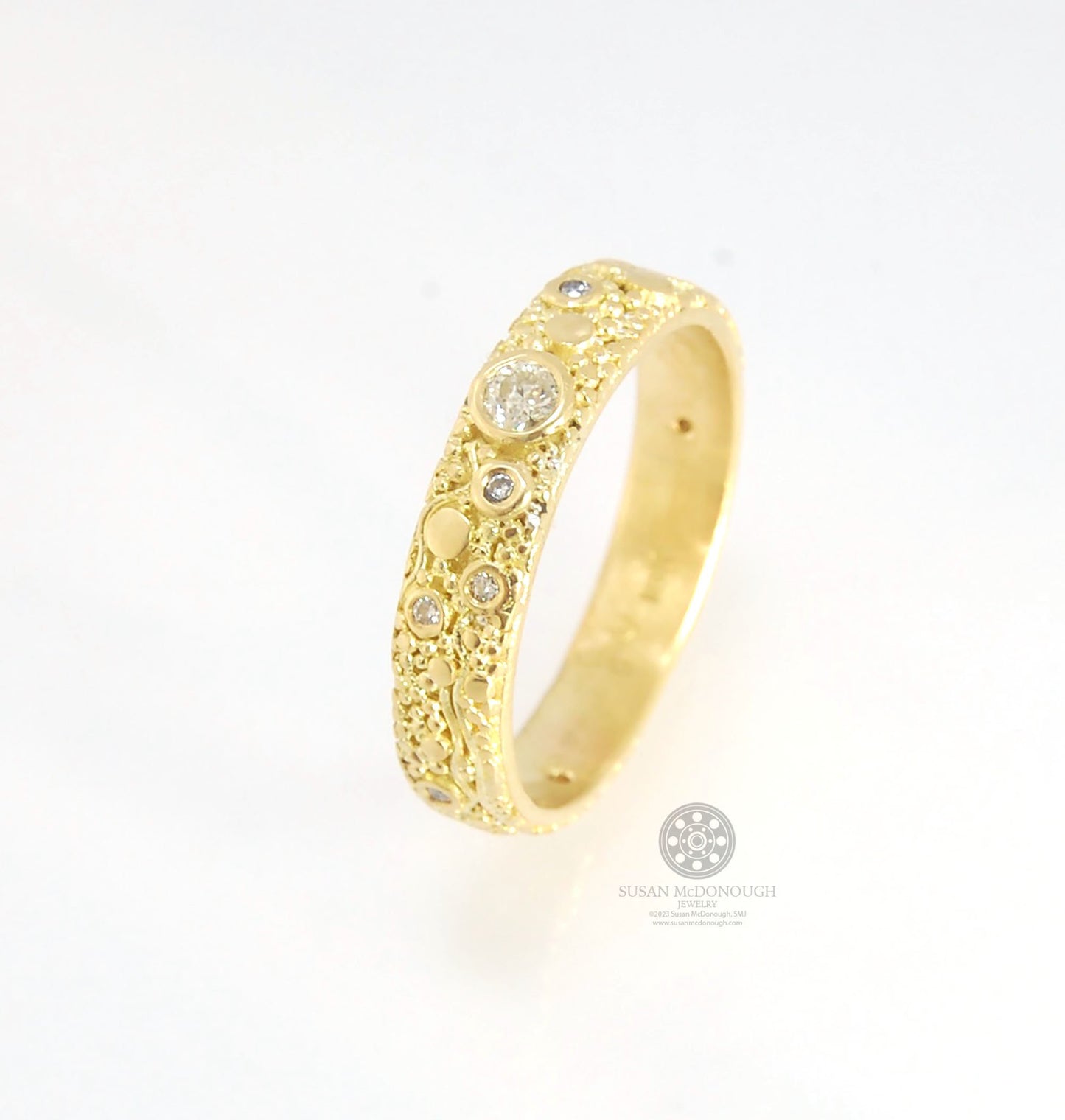 Balance and Flow Band 18k Granulation with 9 Diamonds - Made to Order This is a one-of-a-kind 18k gold and Diamond band made special just for you! The pattern is a balance of twining lines and granules and slices of cylinder ingots to make settings for ni