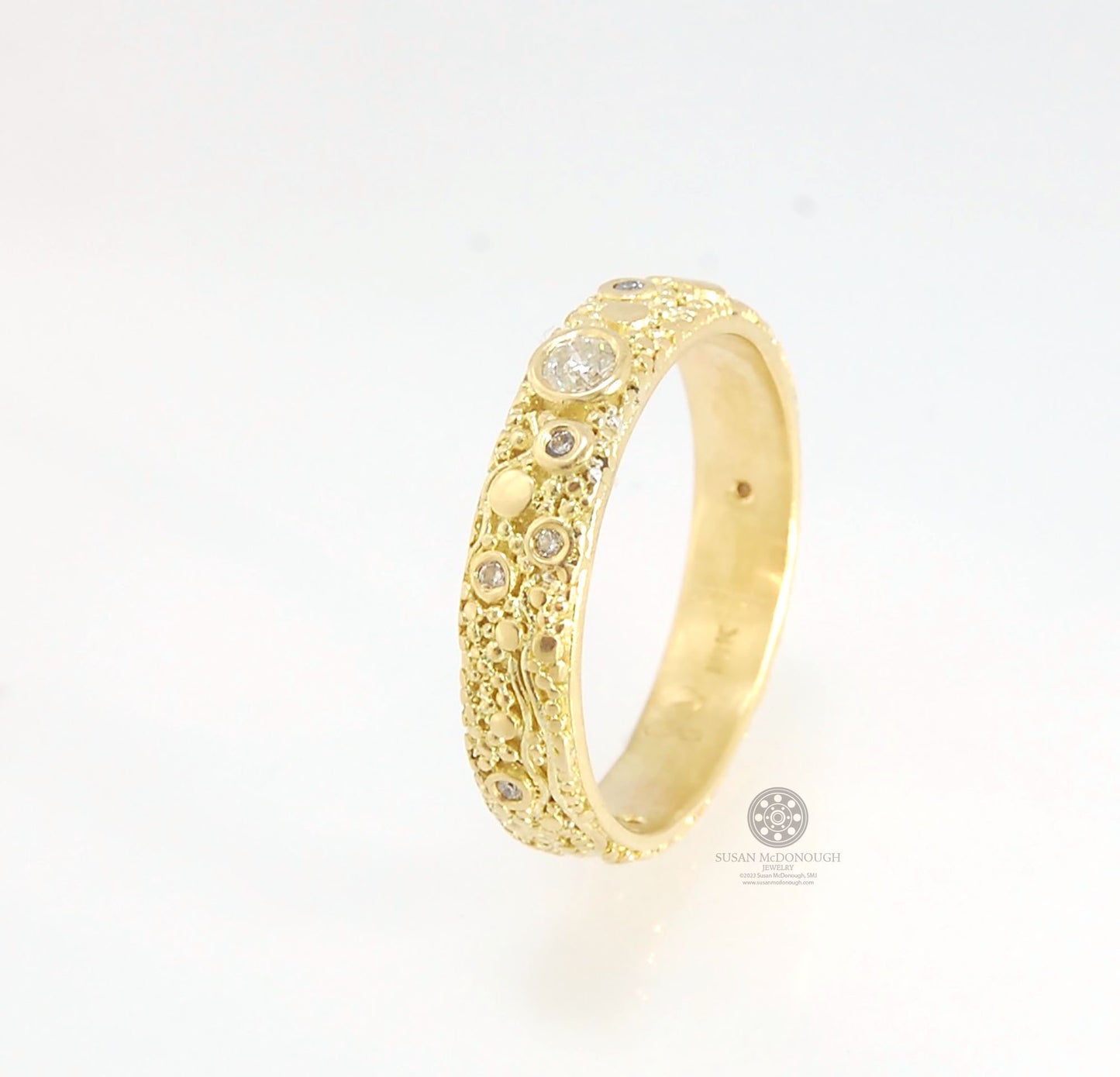 Balance and Flow Band 18k Granulation with 9 Diamonds - Made to Order This is a one-of-a-kind 18k gold and Diamond band made special just for you! The pattern is a balance of twining lines and granules and slices of cylinder ingots to make settings for ni