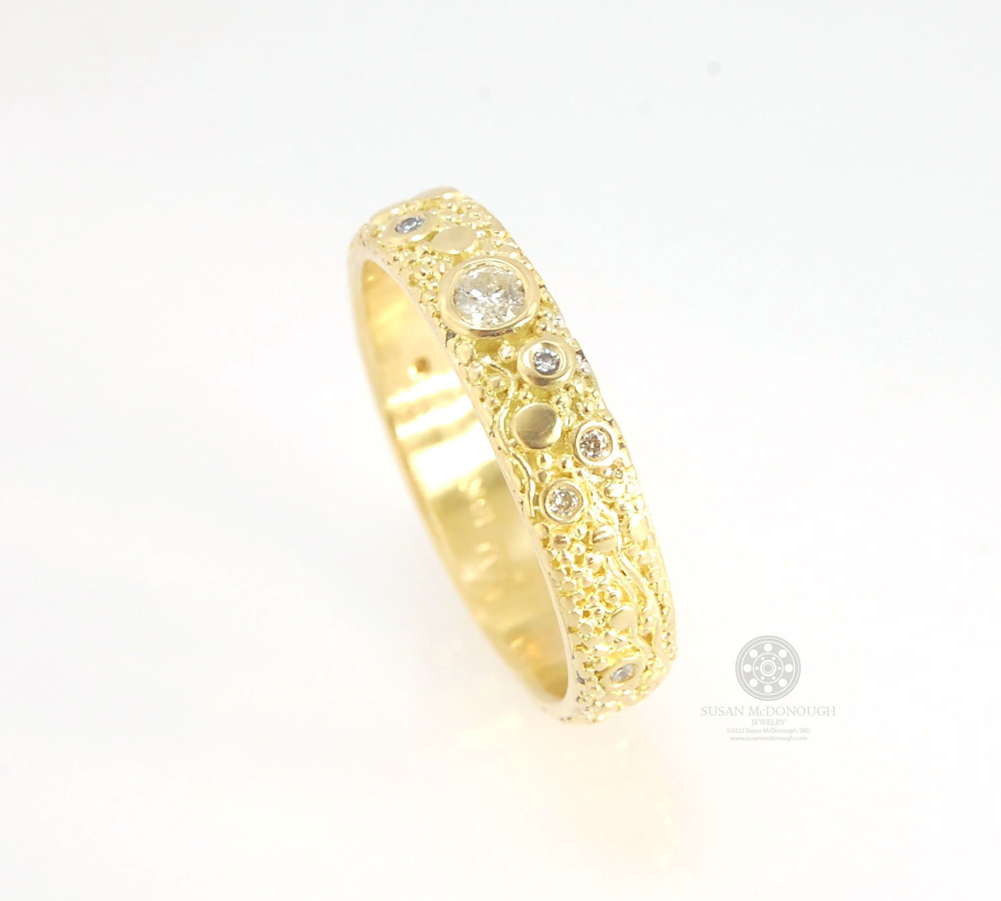 Balance and Flow Band 18k Granulation with 9 Diamonds - Made to Order This is a one-of-a-kind 18k gold and Diamond band made special just for you! The pattern is a balance of twining lines and granules and slices of cylinder ingots to make settings for ni