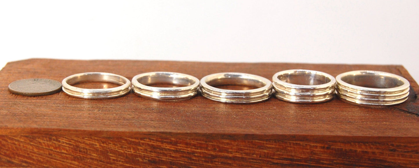 3 Rim Band -6.2mm wide - Sterling silver, 14k or 18k yellow gold This is a 3 rim band cast from a wax carving turned on a lathe and cast using the lost wax process. These are so much fun to make and I have several variations of different rims and widths a