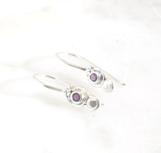 Wisteria Dangle Earrings in Amethyst, Garnet, or Topaz These delicate Wisteria earrings are cast in sterling silver from a Fine Silver granulated original. The have a fixed sterling french hook and can be set with amethyst faceted gem, garnet faceted gems