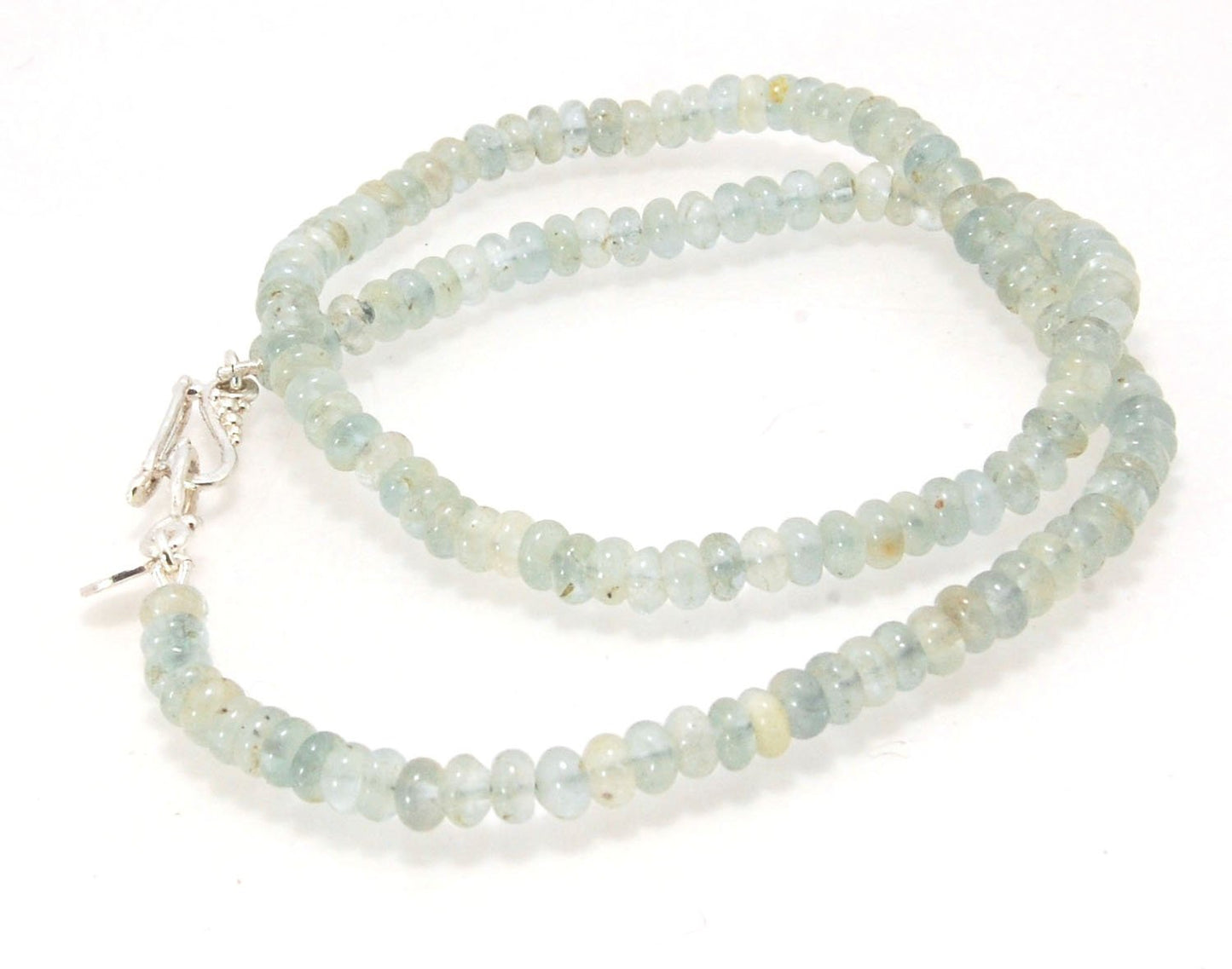 Aquamarine Gemstone Bead Strand with Granulated Sterling Silver safety clasp These ocean-colored Aquamarine rondelle gemstone beads are just lovely on! These beauties have a nice weight and warmth. I have made a sterling silver two-part safety clasp with