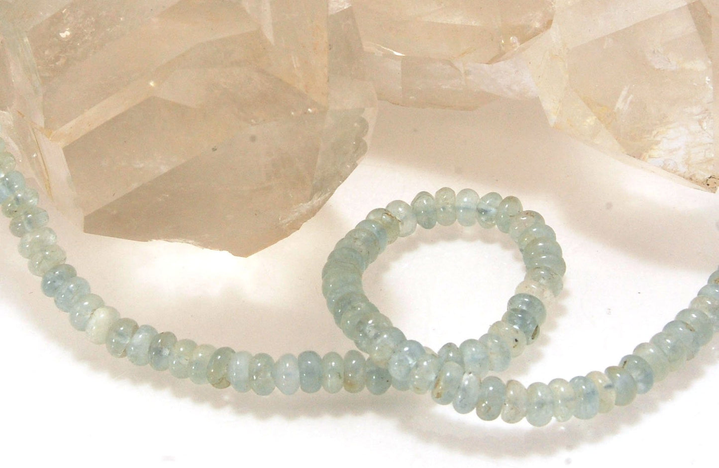 Aquamarine Gemstone Bead Strand with Granulated Sterling Silver safety clasp These ocean-colored Aquamarine rondelle gemstone beads are just lovely on! These beauties have a nice weight and warmth. I have made a sterling silver two-part safety clasp with