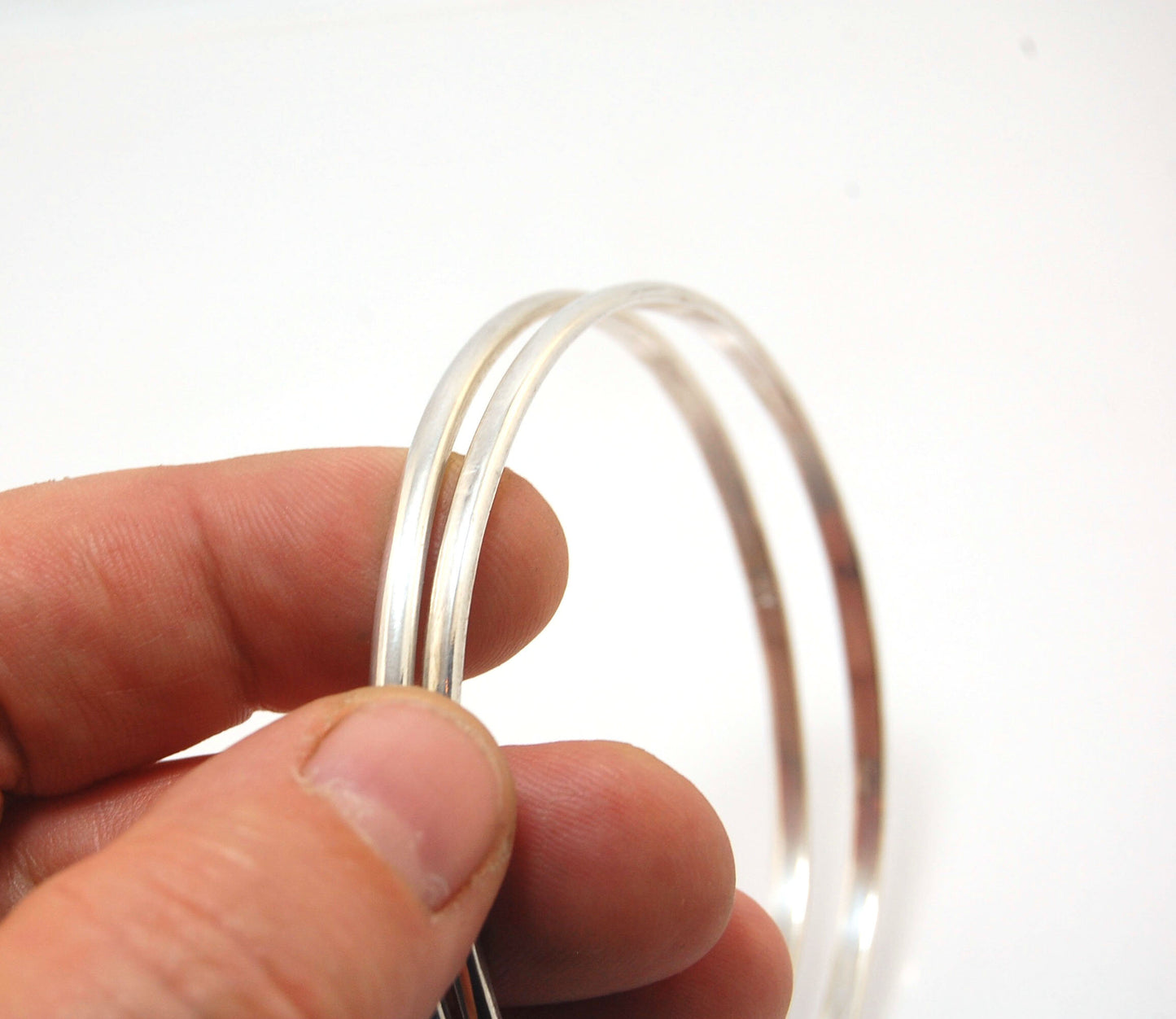 3mm Half Round Sterling Silver Bangles Who doesn’t love a good bangle stack! These bangles are available in 2 finishes. Shiny or Matte.Handmade by me in my studio, I pour a large ingot of sterling silver and roll it out into a half round shape and cut to