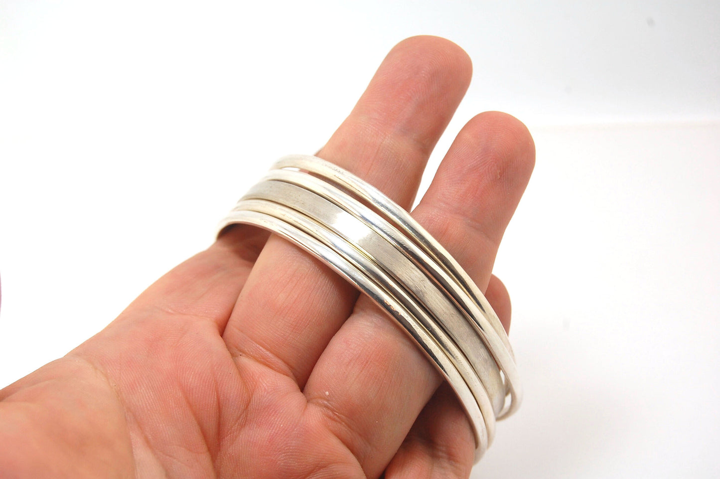 3mm Half Round Sterling Silver Bangles Who doesn’t love a good bangle stack! These bangles are available in 2 finishes. Shiny or Matte.Handmade by me in my studio, I pour a large ingot of sterling silver and roll it out into a half round shape and cut to