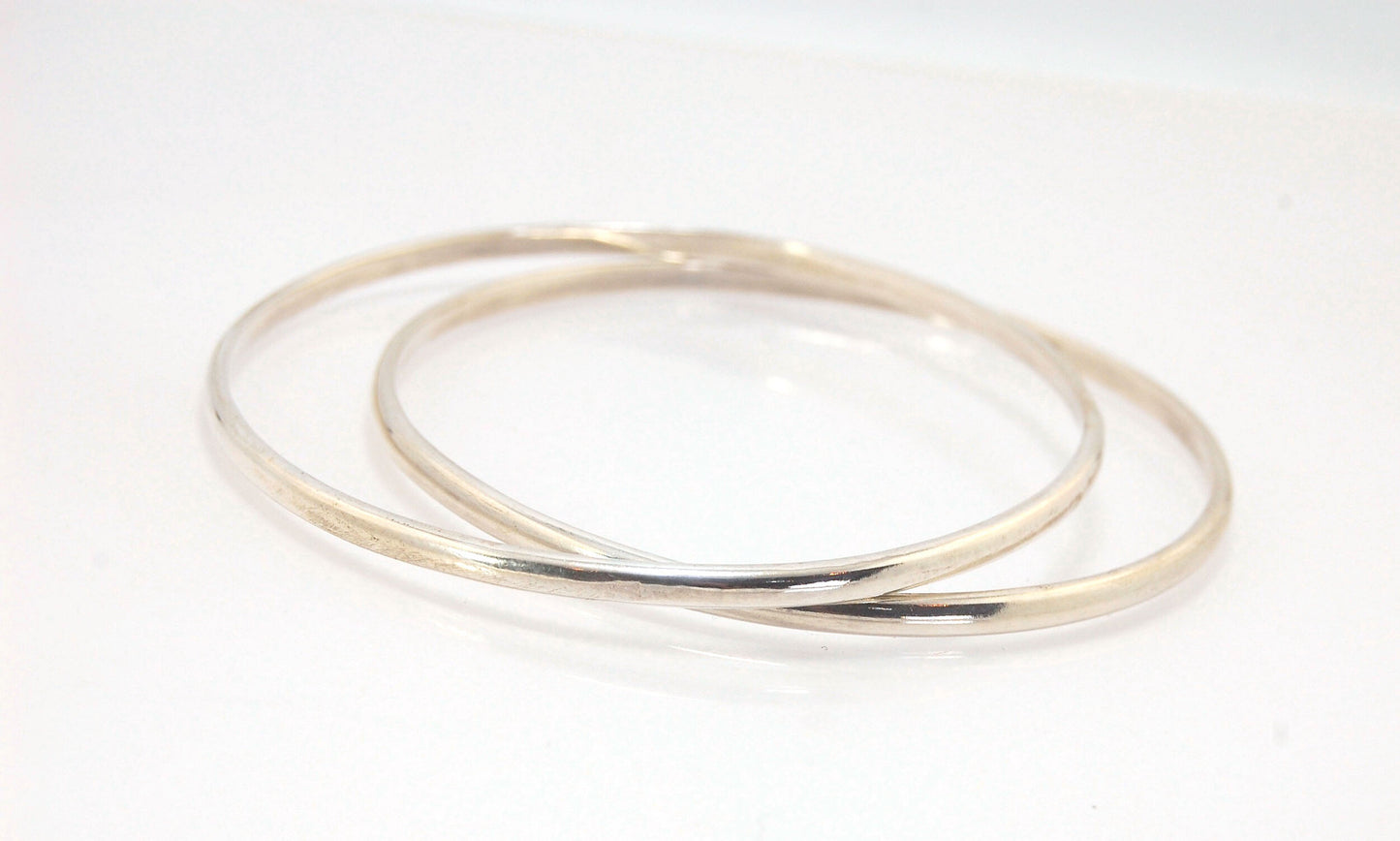 3mm Half Round Sterling Silver Bangles Who doesn’t love a good bangle stack! These bangles are available in 2 finishes. Shiny or Matte.Handmade by me in my studio, I pour a large ingot of sterling silver and roll it out into a half round shape and cut to