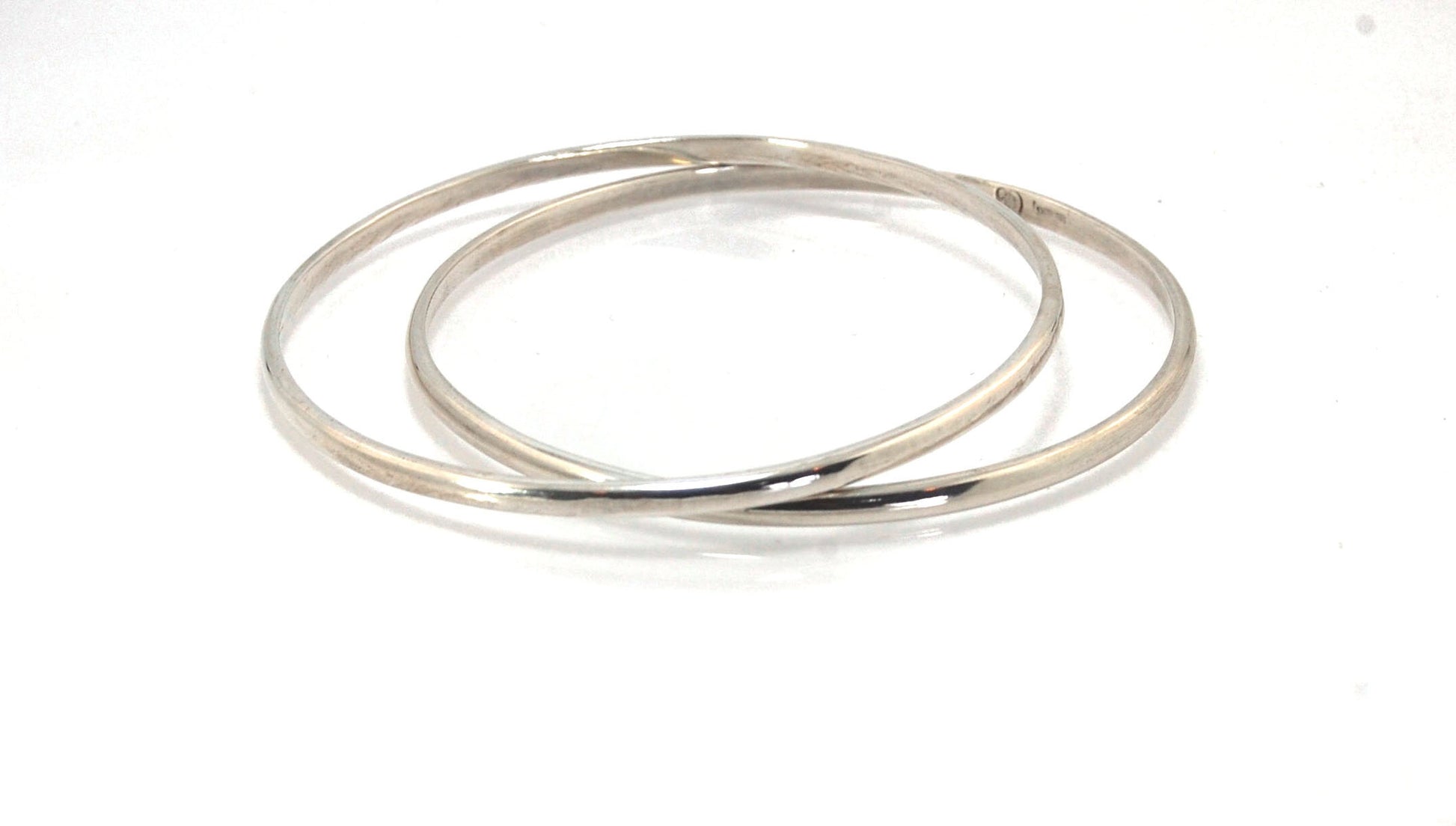 3mm Half Round Sterling Silver Bangles Who doesn’t love a good bangle stack! These bangles are available in 2 finishes. Shiny or Matte.Handmade by me in my studio, I pour a large ingot of sterling silver and roll it out into a half round shape and cut to