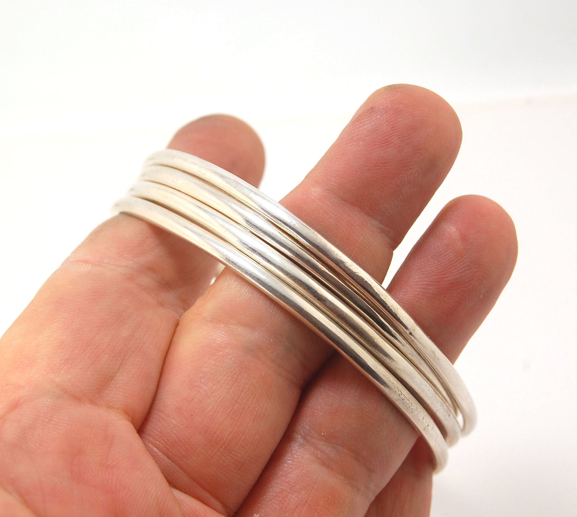 3mm Half Round Sterling Silver Bangles Who doesn’t love a good bangle stack! These bangles are available in 2 finishes. Shiny or Matte.Handmade by me in my studio, I pour a large ingot of sterling silver and roll it out into a half round shape and cut to