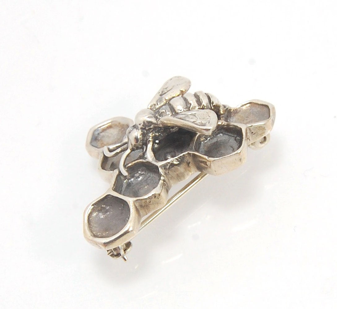 Honeycomb and Bee Pin Carved in Wax and Cast using the Lost Wax process. This bee and honeycomb has a sterling pin back and catch. Perfect for suit jackets, lapels, bee suits, hats and overalls. One of a Kind 30mm x 20mm