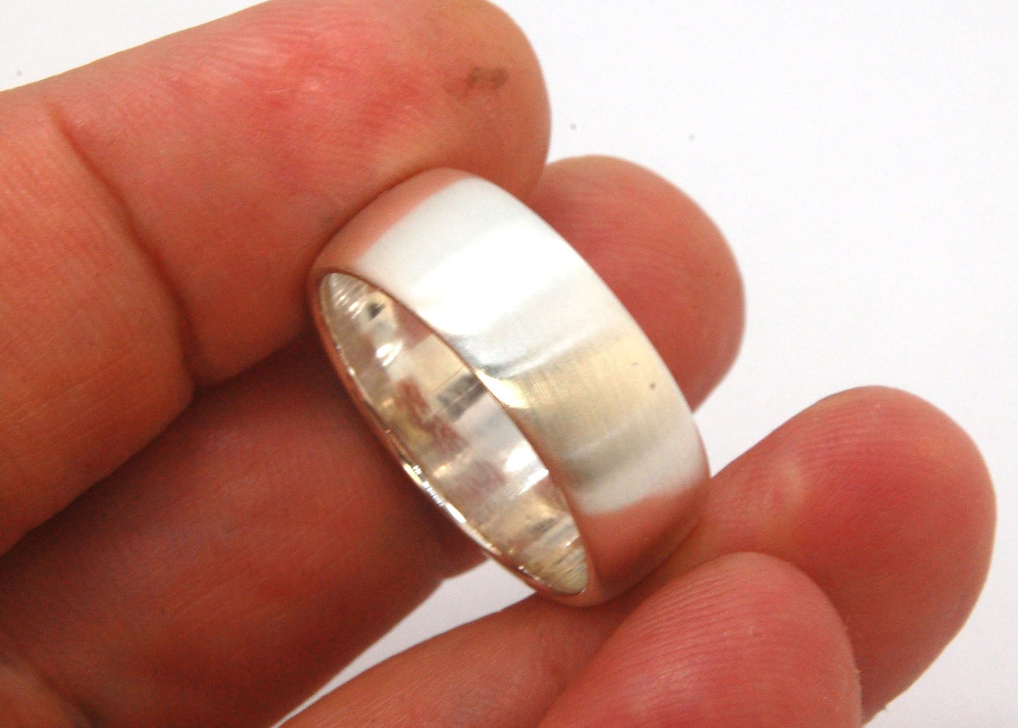 Real Wide Flat Half Round Band Ring in Sterling Silver This is a Real Wide Flat Half Round Band Ring cast from a wax carving. 8mm wide and 2.5mm thick, this ring was turned on a lathe in wax and cast using the lost wax process. These are so much fun to ma