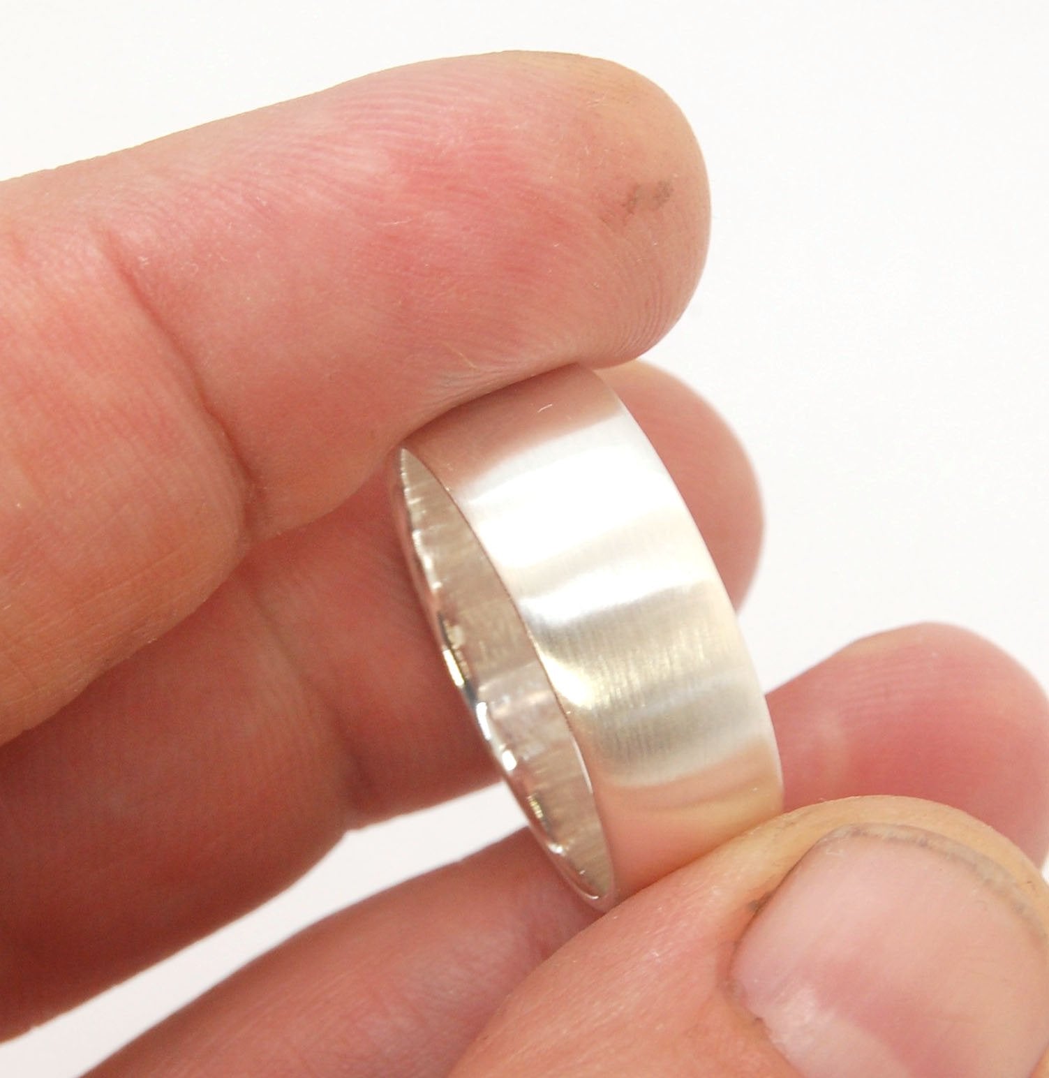 Real Wide Flat Half Round Band Ring in Sterling Silver This is a Real Wide Flat Half Round Band Ring cast from a wax carving. 8mm wide and 2.5mm thick, this ring was turned on a lathe in wax and cast using the lost wax process. These are so much fun to ma