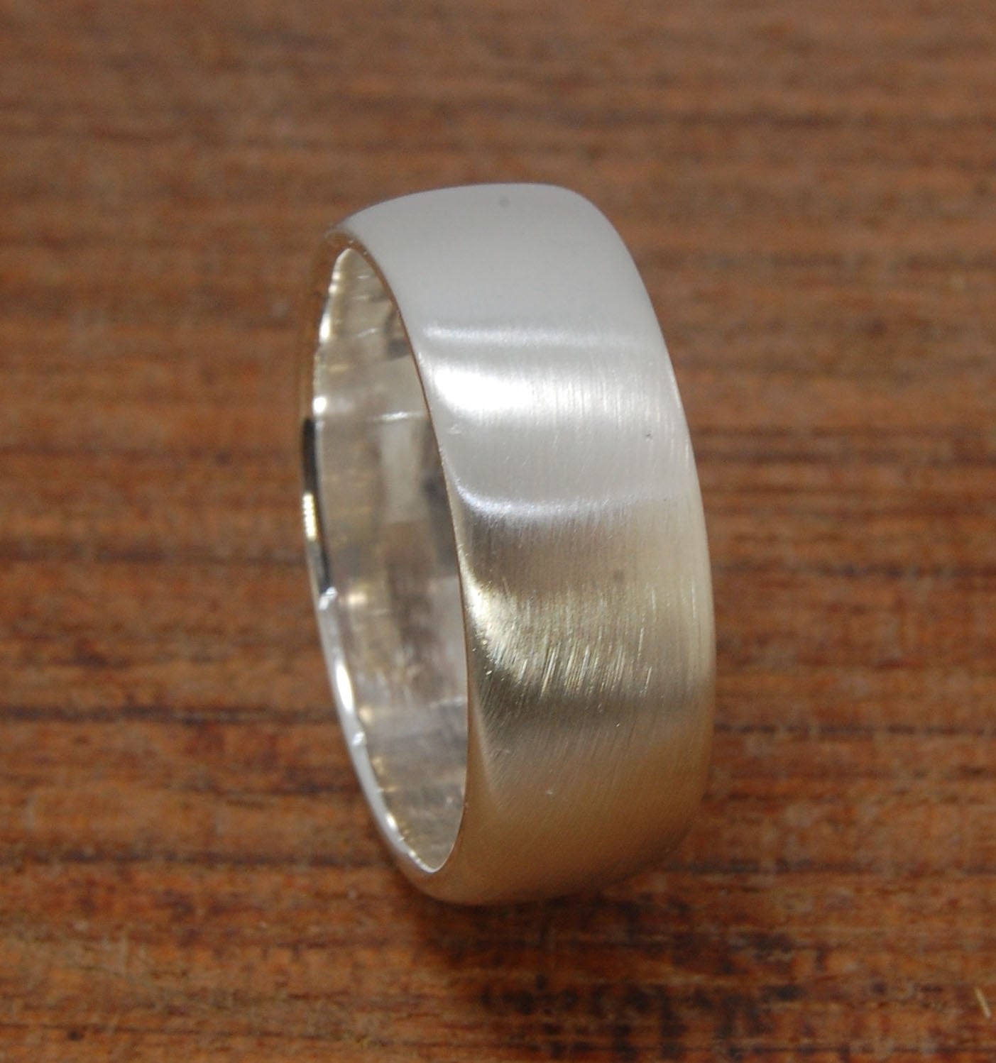 Real Wide Flat Half Round Band Ring in Sterling Silver This is a Real Wide Flat Half Round Band Ring cast from a wax carving. 8mm wide and 2.5mm thick, this ring was turned on a lathe in wax and cast using the lost wax process. These are so much fun to ma