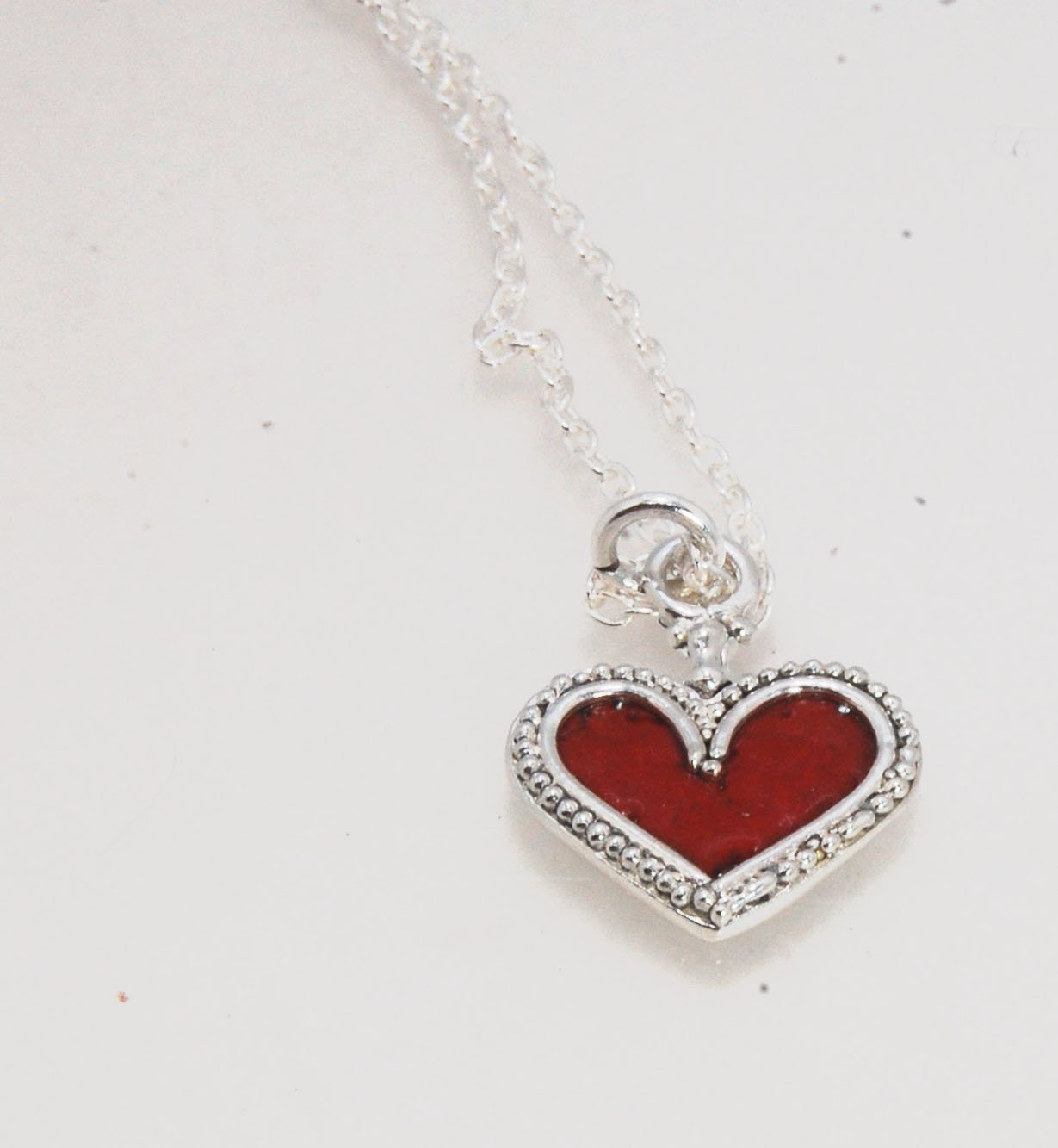 Enamel Heart Charm in Fine SIlver It’s a HEART of fine silver granulation that I made a mold of, then cast, then enameled! In your choice of colors: Red, Purple, Green, Black, Azalea, HollyhockGranulation is an ancient fusing process utilized for thousand