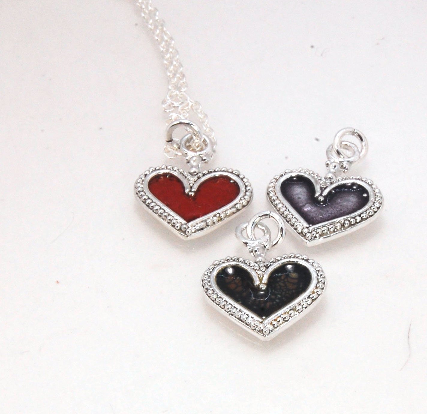 Enamel Heart Charm in Fine SIlver It’s a HEART of fine silver granulation that I made a mold of, then cast, then enameled! In your choice of colors: Red, Purple, Green, Black, Azalea, HollyhockGranulation is an ancient fusing process utilized for thousand