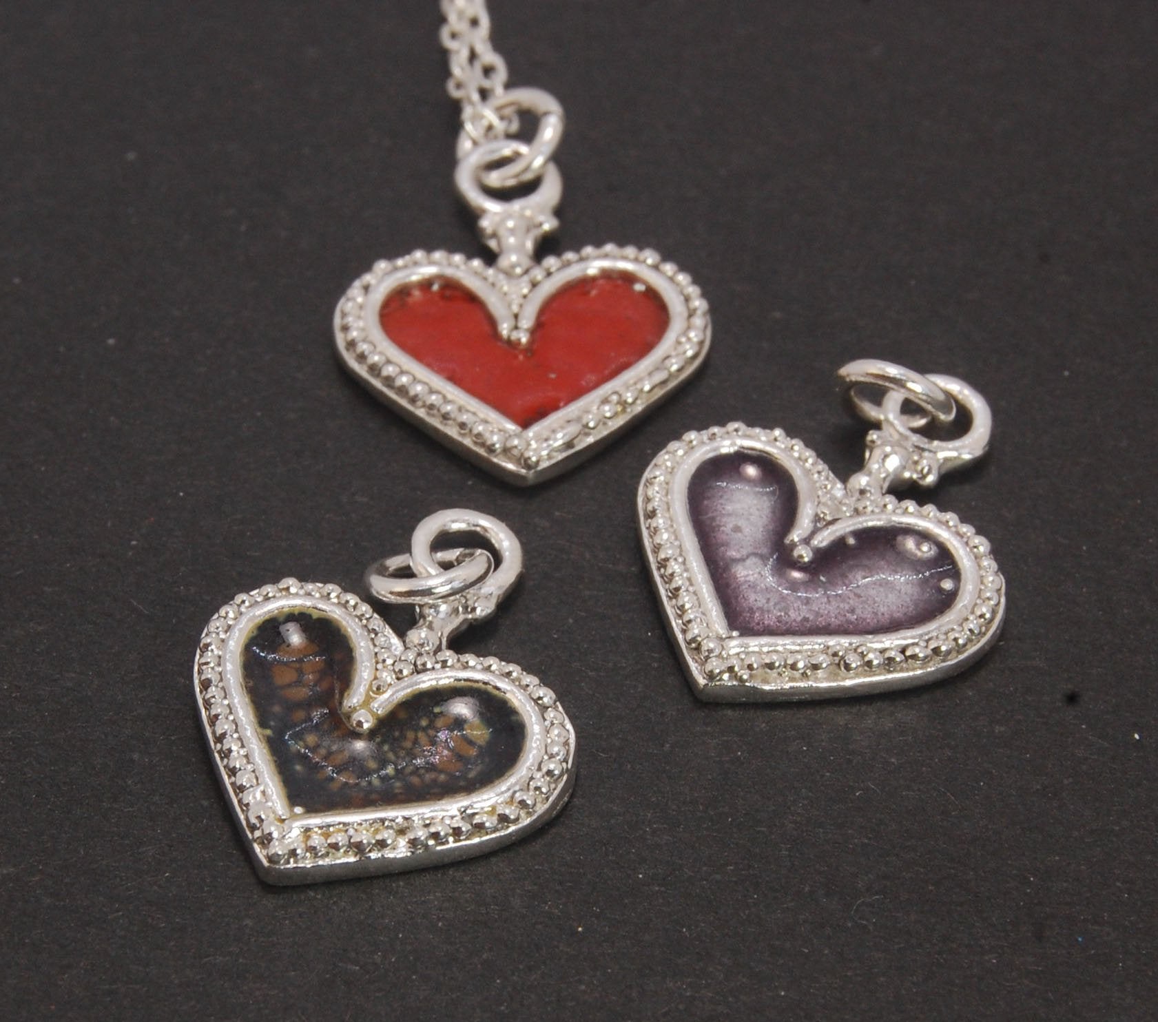 Enamel Heart Charm in Fine SIlver It’s a HEART of fine silver granulation that I made a mold of, then cast, then enameled! In your choice of colors: Red, Purple, Green, Black, Azalea, HollyhockGranulation is an ancient fusing process utilized for thousand