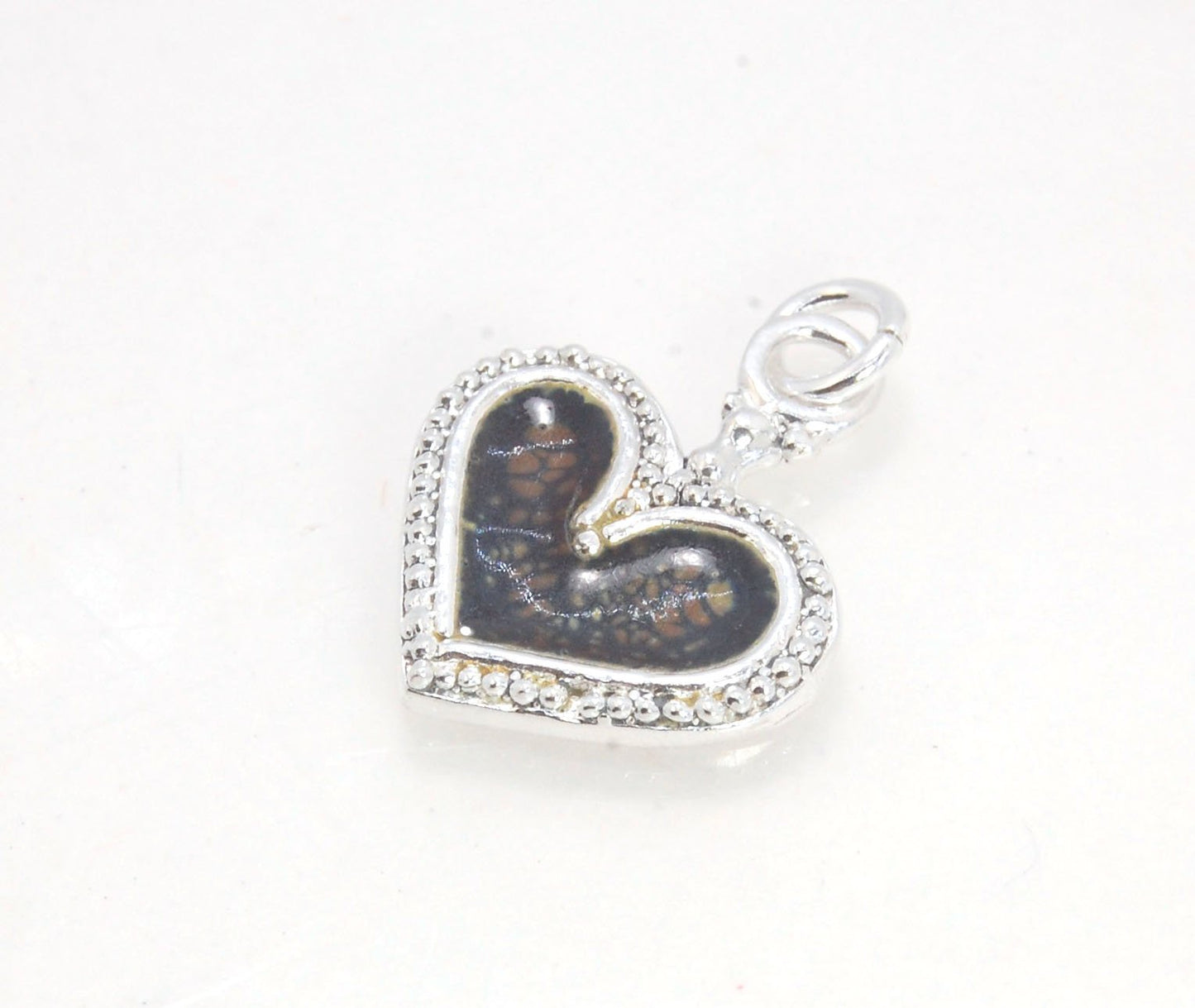 Enamel Heart Charm in Fine SIlver It’s a HEART of fine silver granulation that I made a mold of, then cast, then enameled! In your choice of colors: Red, Purple, Green, Black, Azalea, HollyhockGranulation is an ancient fusing process utilized for thousand