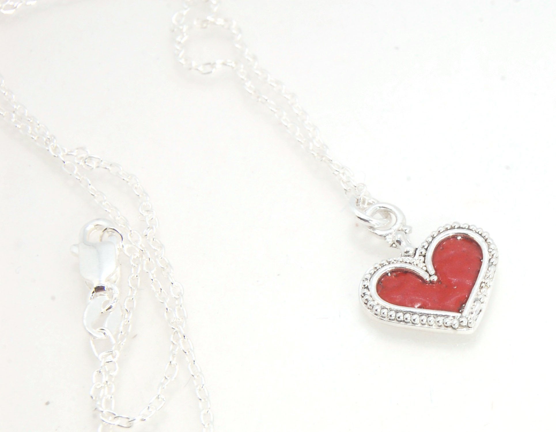 Enamel Heart Charm in Fine SIlver It’s a HEART of fine silver granulation that I made a mold of, then cast, then enameled! In your choice of colors: Red, Purple, Green, Black, Azalea, HollyhockGranulation is an ancient fusing process utilized for thousand