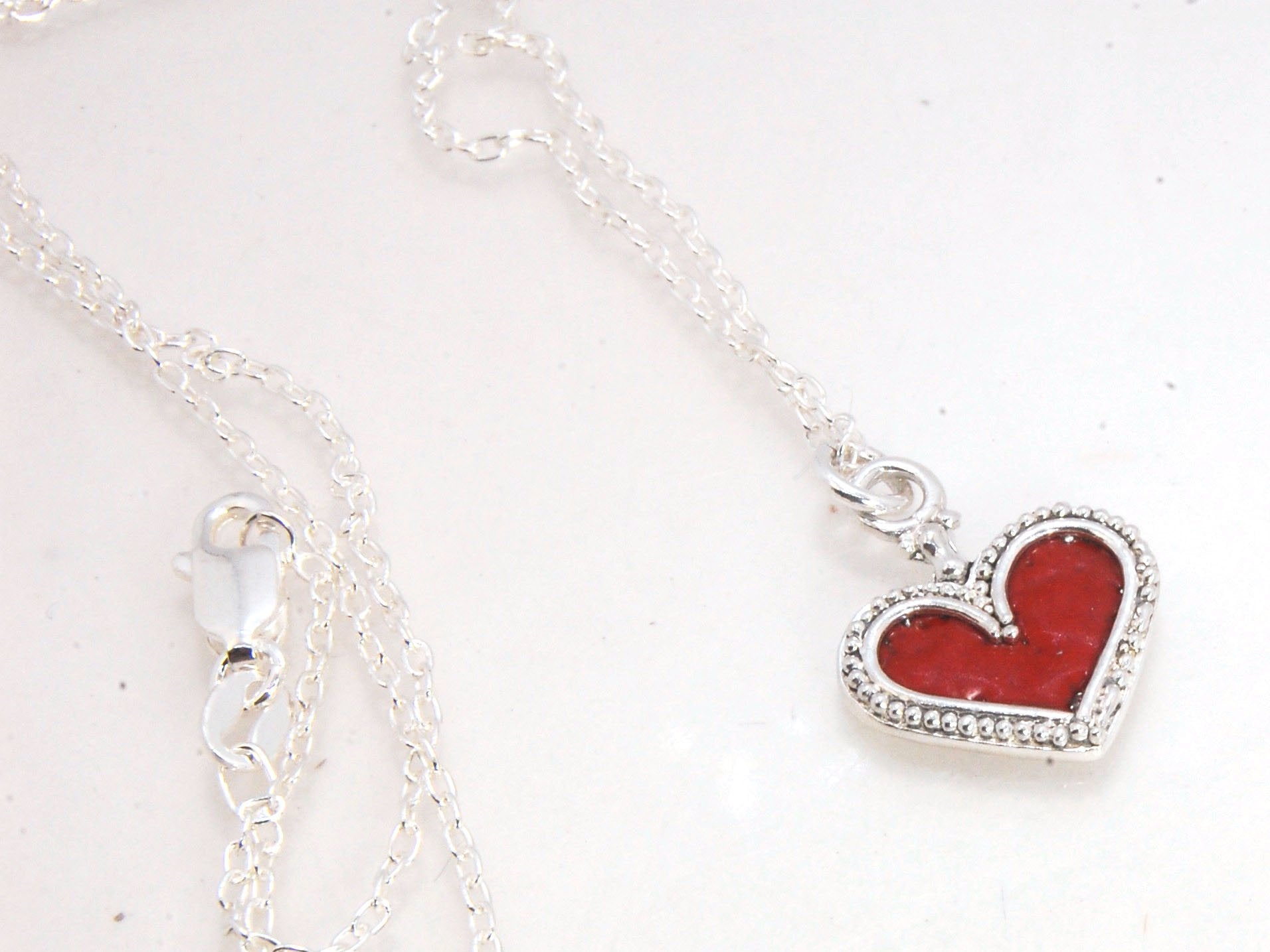 Enamel Heart Charm in Fine SIlver It’s a HEART of fine silver granulation that I made a mold of, then cast, then enameled! In your choice of colors: Red, Purple, Green, Black, Azalea, HollyhockGranulation is an ancient fusing process utilized for thousand