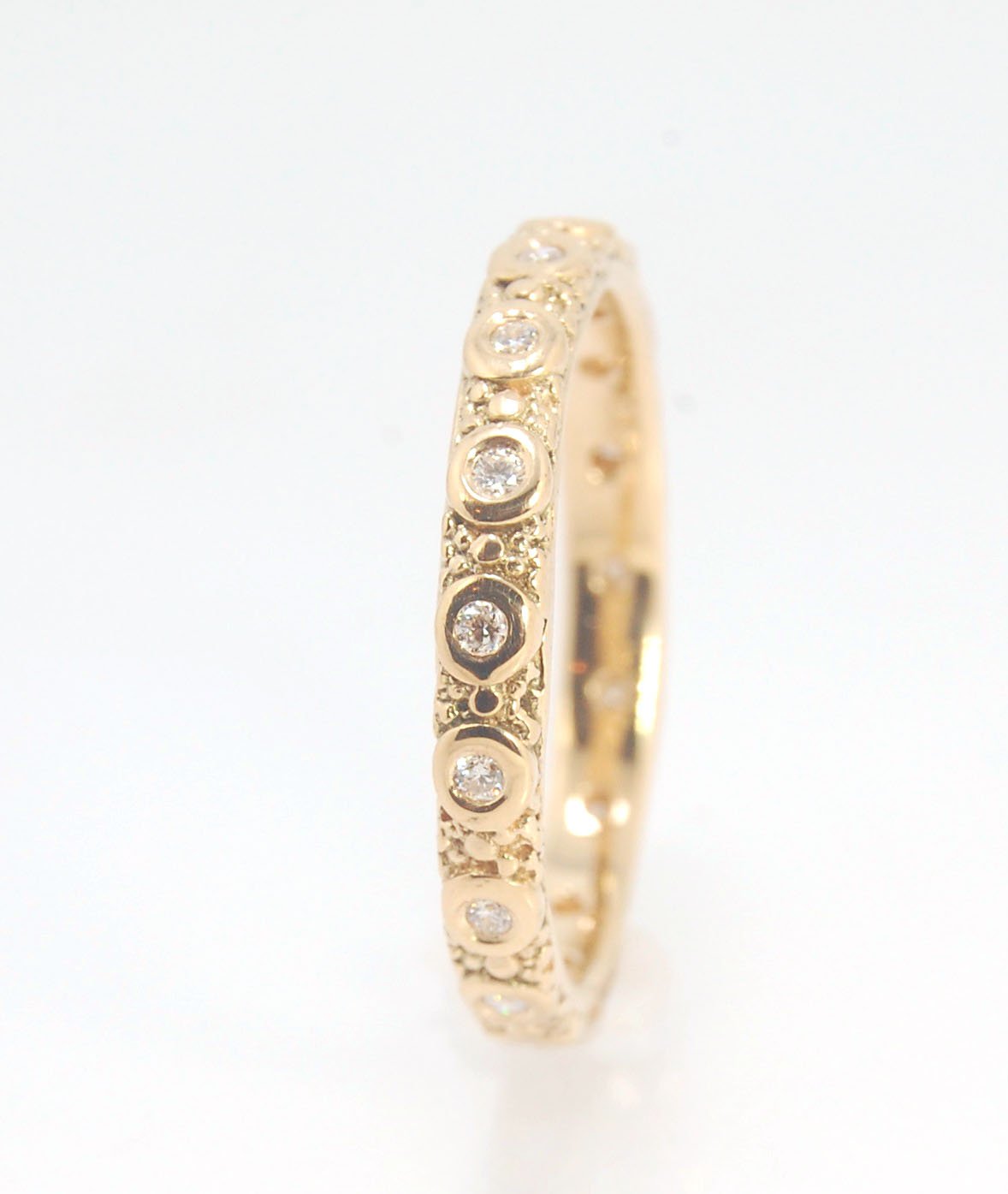 Diamond Eternity Band - Order in 14k, 18k or Sterling Silver The subtle sparkle of this band is a delight! This is a 3mm patterned band with ethically sourced, 1.5 mm SI2-SI3 F+ Round Diamonds bezel set in each disc around the band. This is a cast version