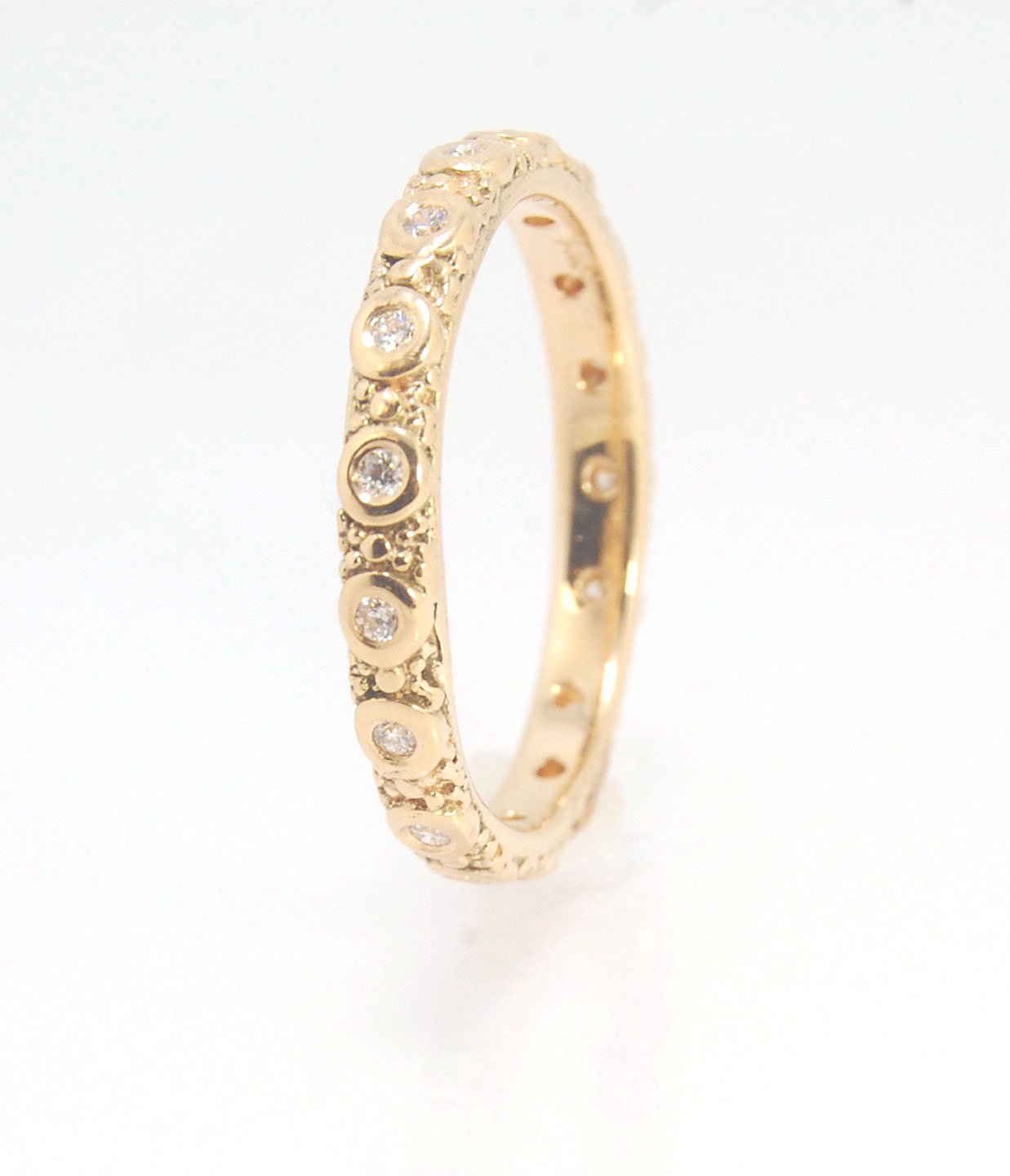 Diamond Eternity Band - Order in 14k, 18k or Sterling Silver The subtle sparkle of this band is a delight! This is a 3mm patterned band with ethically sourced, 1.5 mm SI2-SI3 F+ Round Diamonds bezel set in each disc around the band. This is a cast version