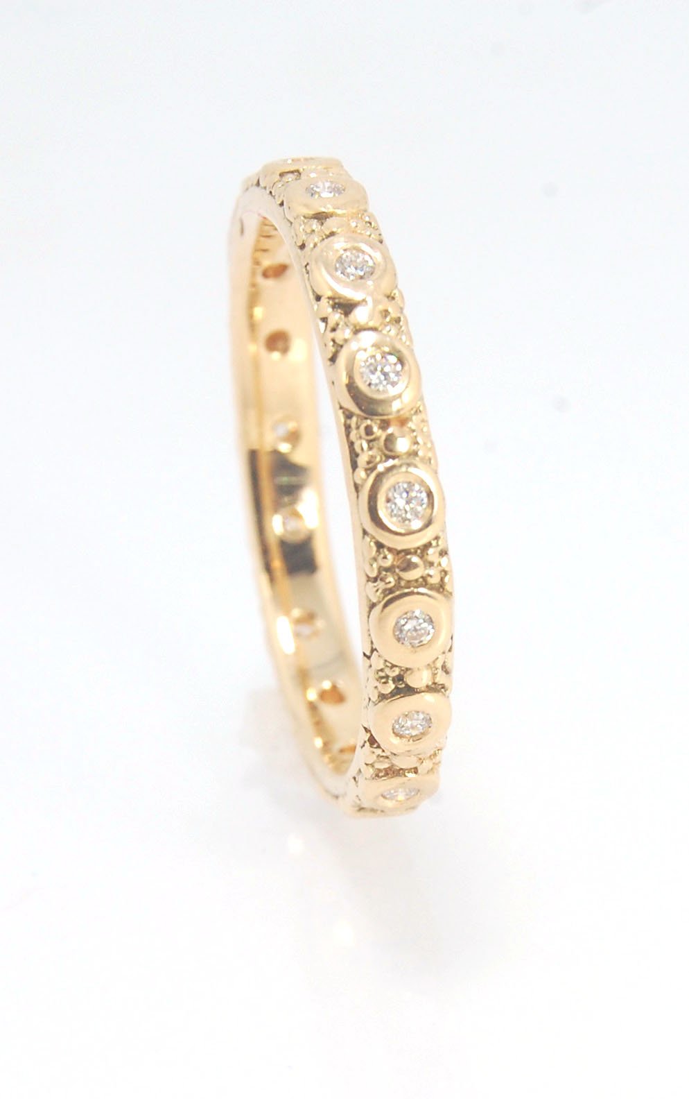 Diamond Eternity Band - Order in 14k, 18k or Sterling Silver The subtle sparkle of this band is a delight! This is a 3mm patterned band with ethically sourced, 1.5 mm SI2-SI3 F+ Round Diamonds bezel set in each disc around the band. This is a cast version