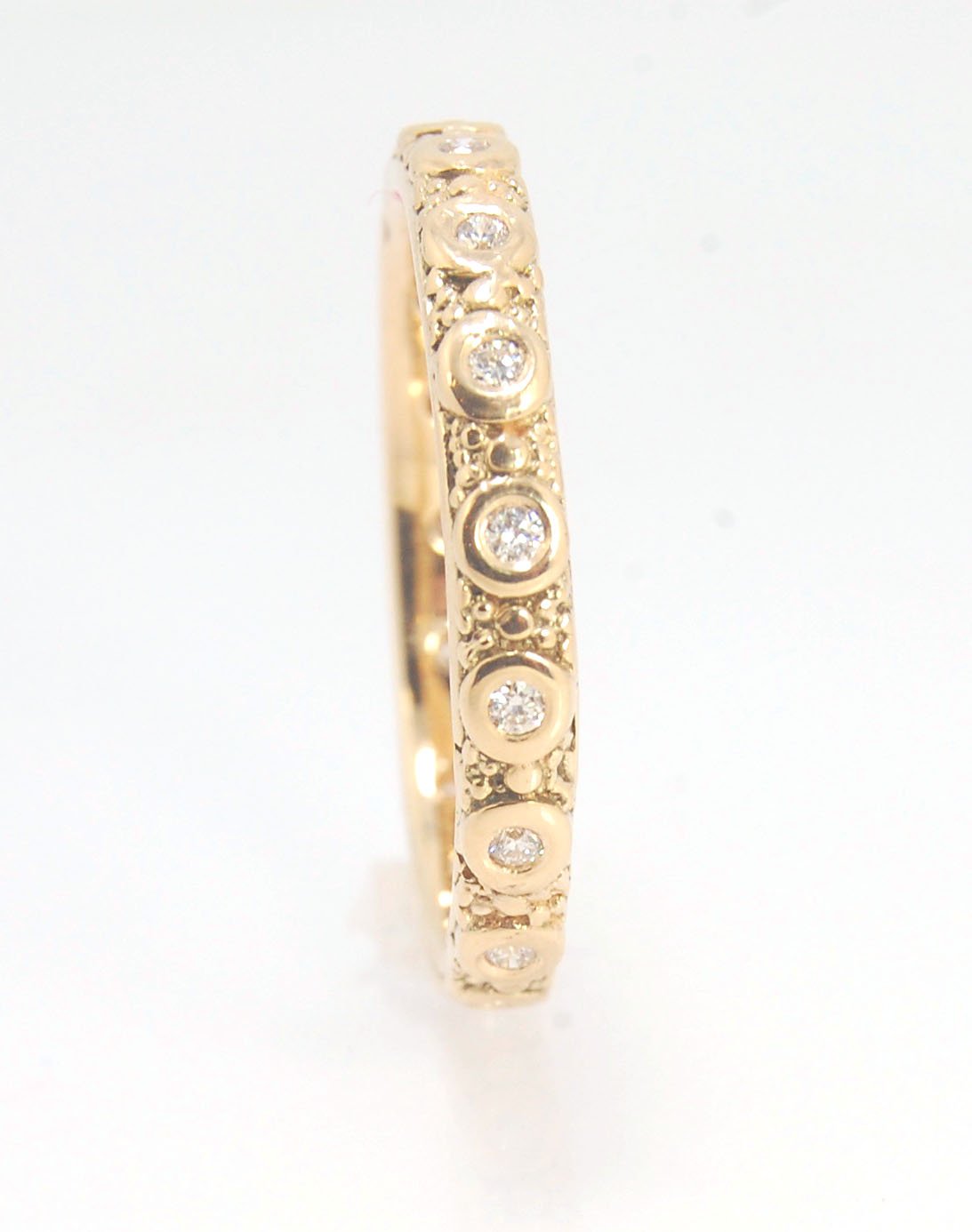 Diamond Eternity Band - Order in 14k, 18k or Sterling Silver The subtle sparkle of this band is a delight! This is a 3mm patterned band with ethically sourced, 1.5 mm SI2-SI3 F+ Round Diamonds bezel set in each disc around the band. This is a cast version