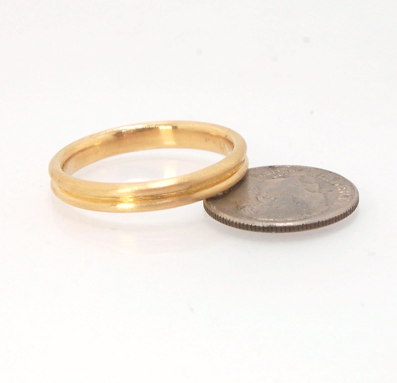 2 Rim 3.3mm Wide Band - Sterling silver, 14k or 18k yellow gold This is a narrow, 3.3mm, 2 rim band cast from a wax carving turned on a lathe. These are so much fun to make and I have several variations of different rims and widths available. I then take