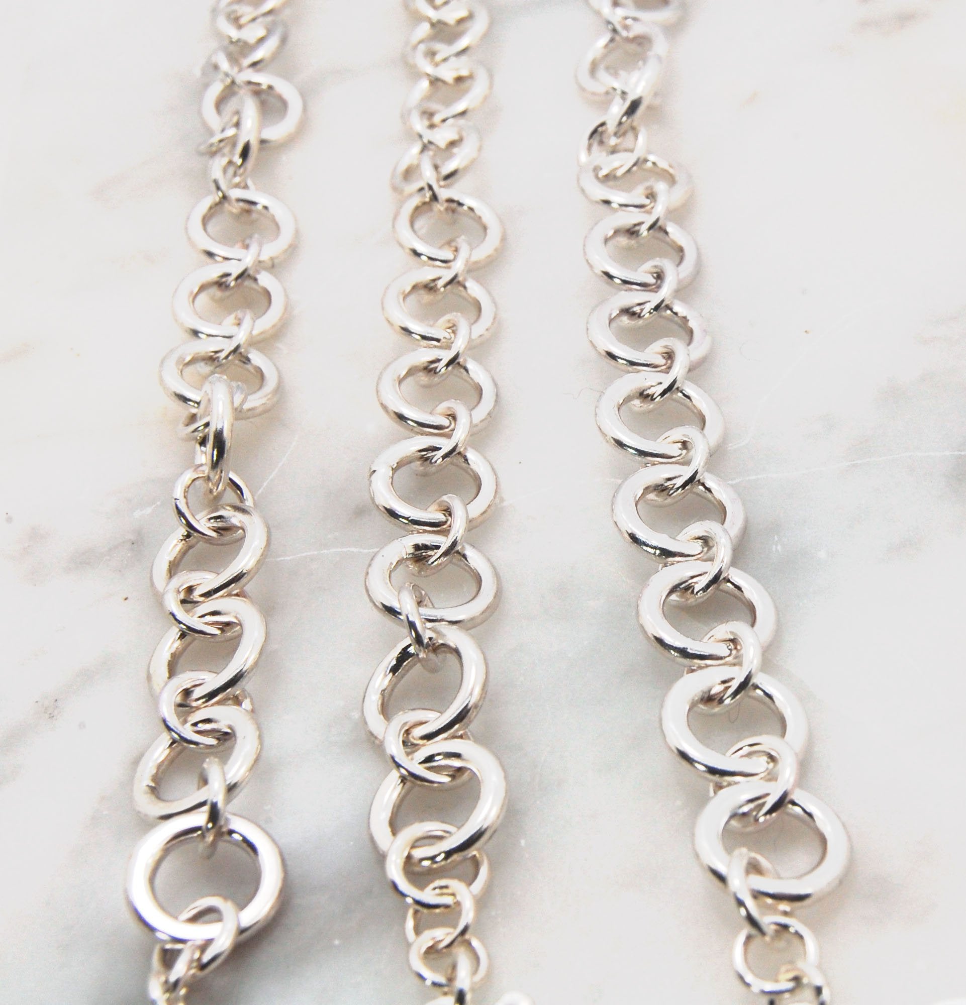 Shimmer Hammered Link Bracelet in Sterling Silver with Forged Safety clasp - in 4 size These are lovely silver bracelets, solid, with a hand-forged hook safety clasp.This heavy link bracelet is hand formed. Each link is run though the rolling mill to flat