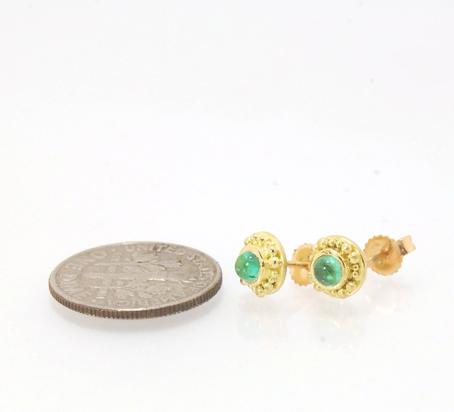 Emerald Cabochon 18k post earrings These stunning emerald cabochons are bezel-set in 18k gold with 18k granulation around the outside. These are 18k gold post earrings with a 14k gold ear nut. Classic and understated. But that color, though! Ya’ll know I