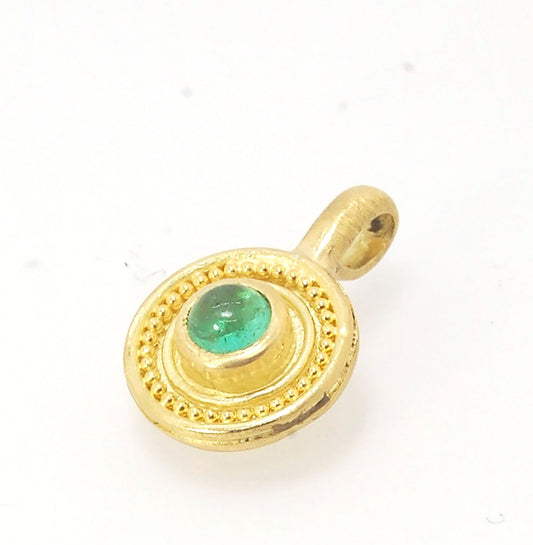 Emerald Cabochon 22k gold Tiny Granulated Disk Pendant The sweetest tiny emerald pendant yet!This lovely, luminous, ethically sourced emerald is bezel-set in 18k rich yellow gold granulation on 18k gold. Granulation is an ancient fusing process utilized f