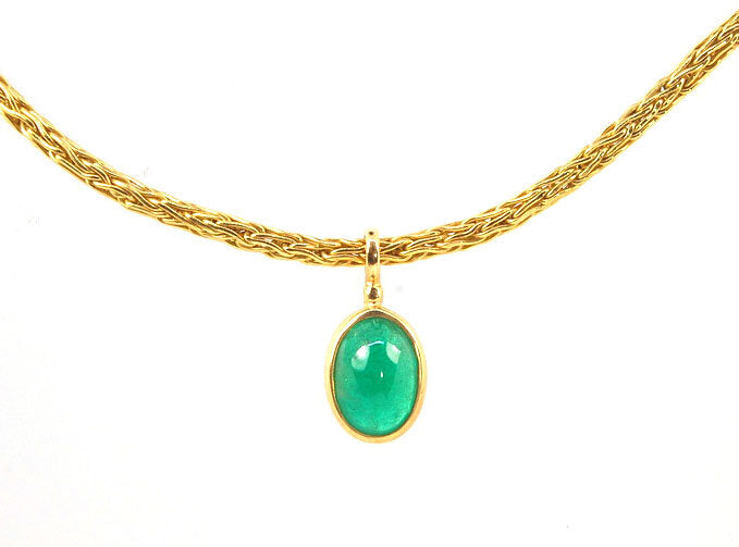 Emerald Cabochon on Handmade Woven 18k gold chain This clear emerald cabochon is bezel-set in 18k gold and suspended from a handmade woven chain of 18k gold in ancient Viking knit. A forged hook clasp finishes this simple and elegant design. Emerald Caboc