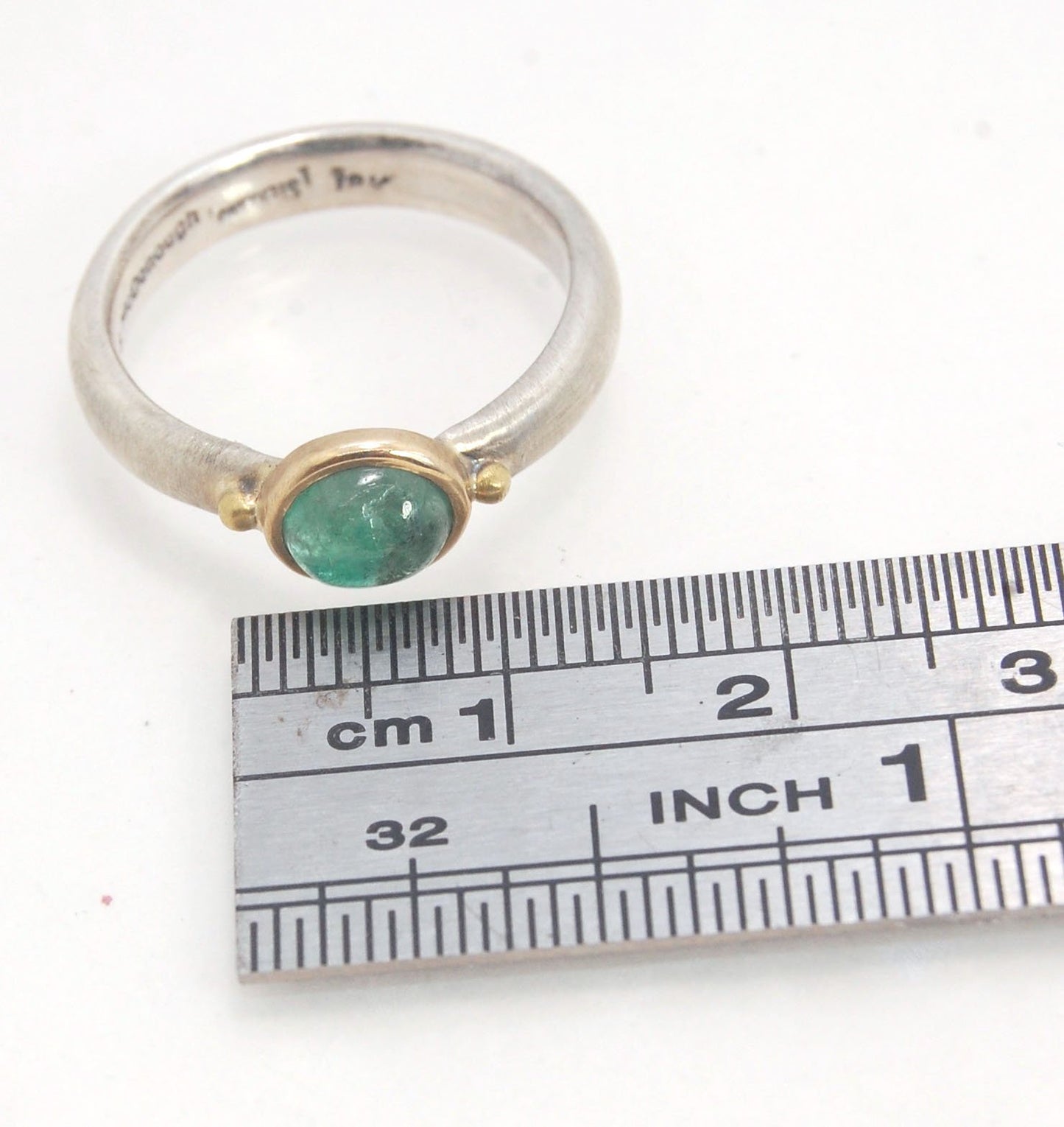 Emerald Bi Metal Freckle Ring - 14k and Sterling Silver - Size 8 This is a unique emerald cabochon with a darker freckle included in the lighter-colored emerald! This emerald cabochon is bezel-set in 14k gold with large gold granules on the Sterling Silve